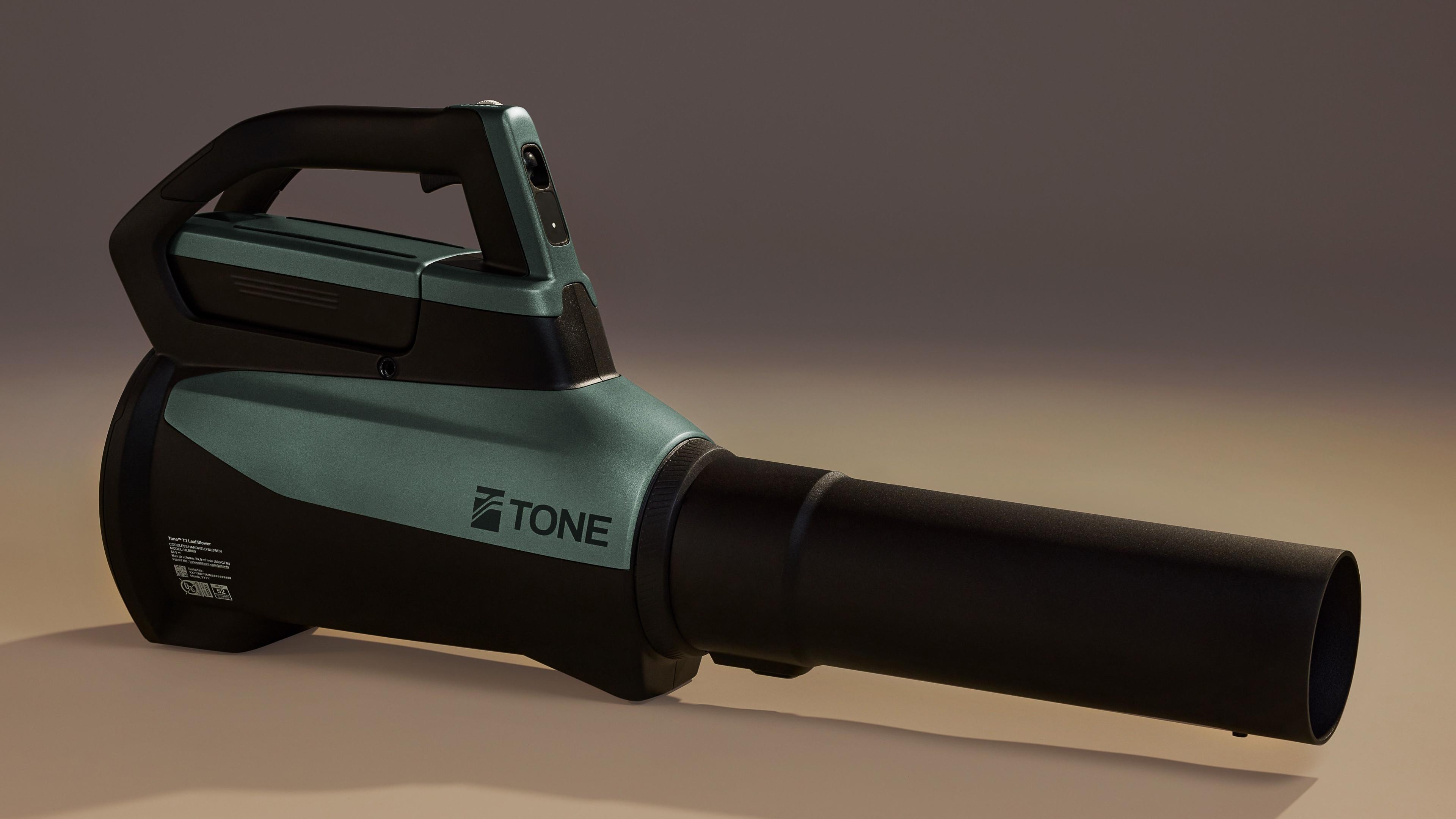 Whisper Aero's sleek leaf blower. The body is green and black and the nozzle is black.