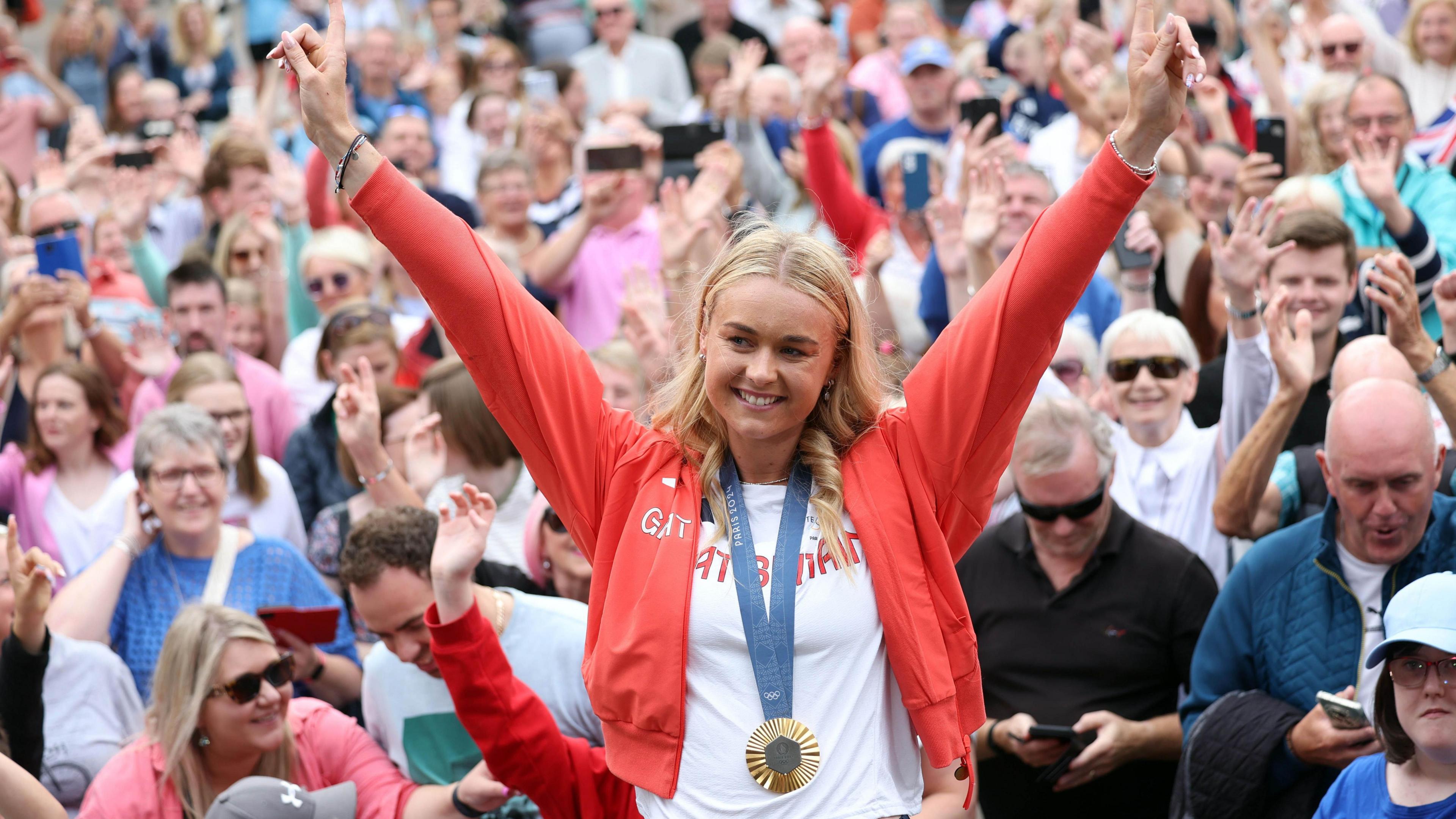 Hannah Scott celebrates winning her Olympic gold medal