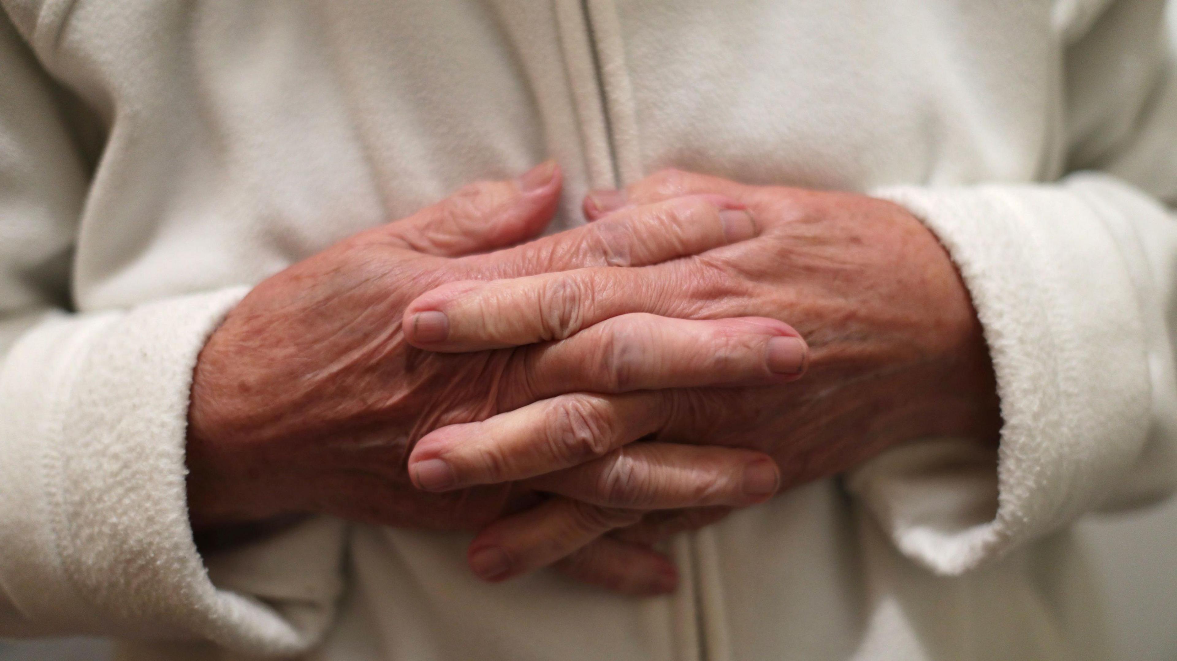 A women with her hands held together
