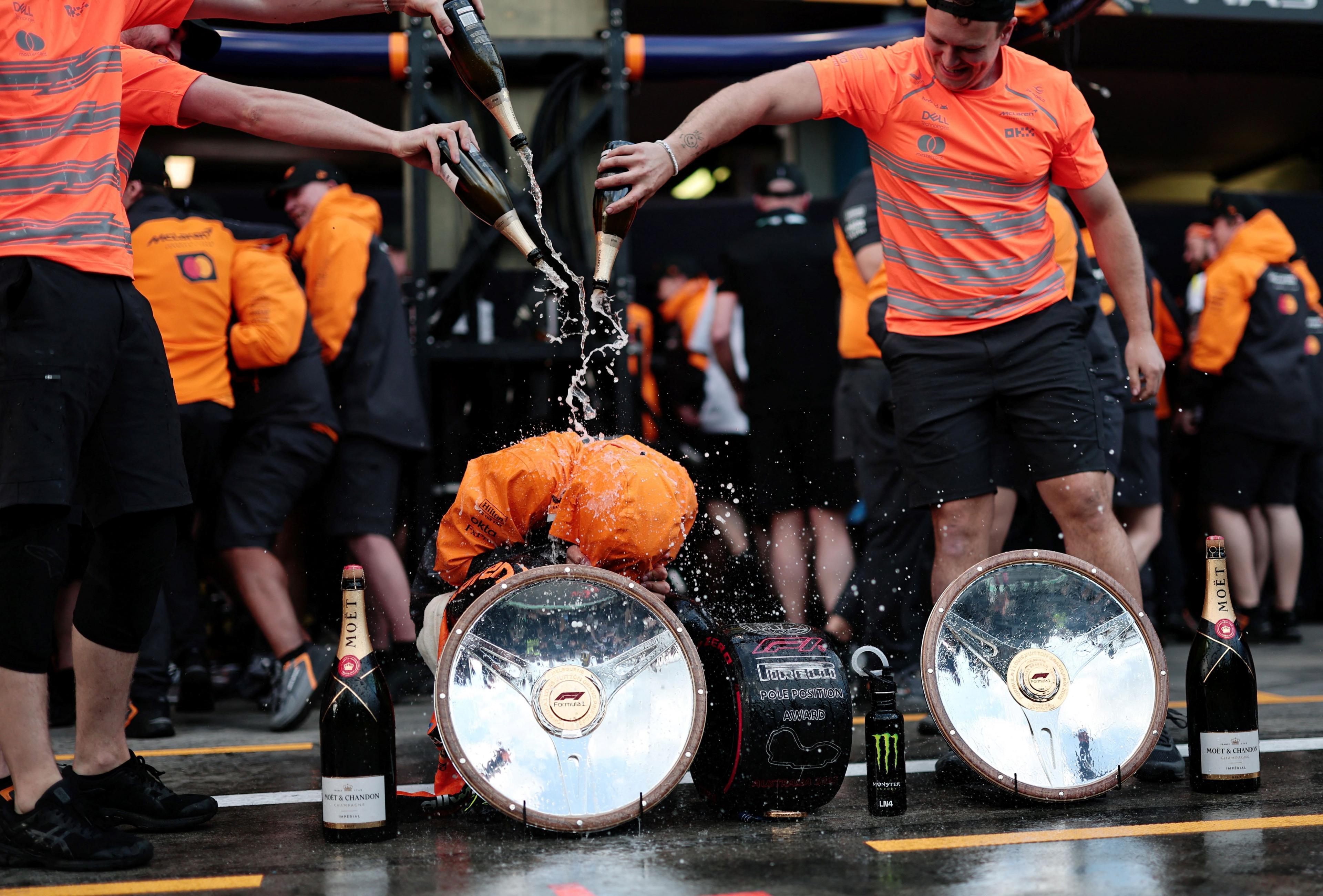 McLaren team pour Champaign on Lando Norris after his win