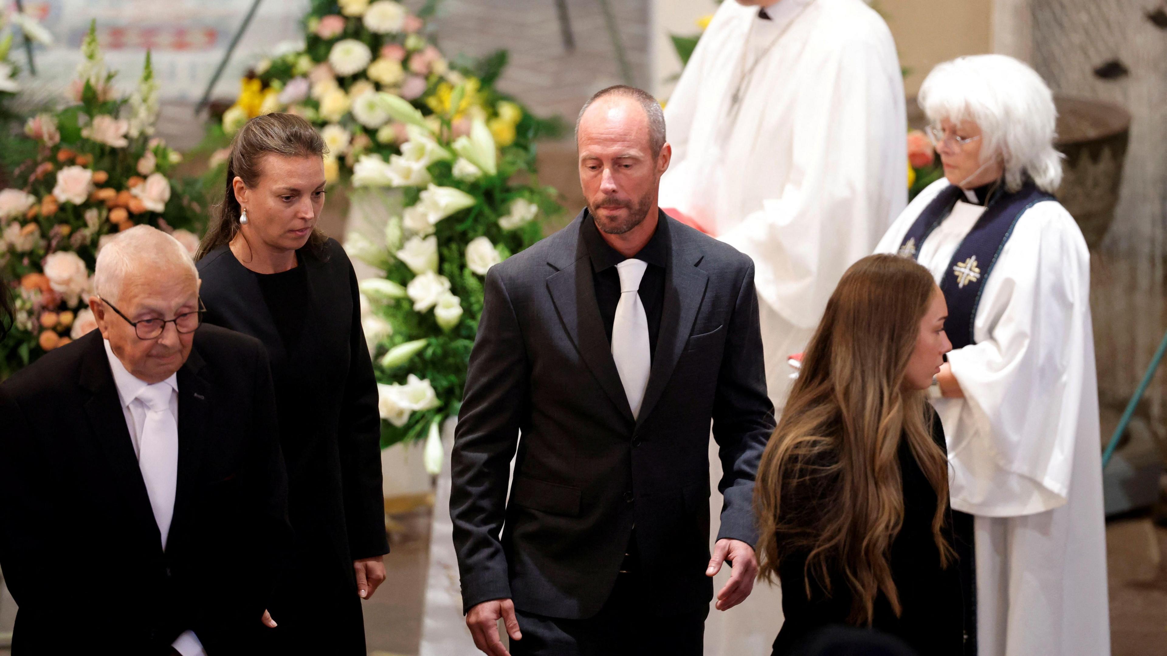 Sven-Goran Eriksson's father, Sven (left), daughter Lina (centre left) and son Johan (centre right) at a funeral