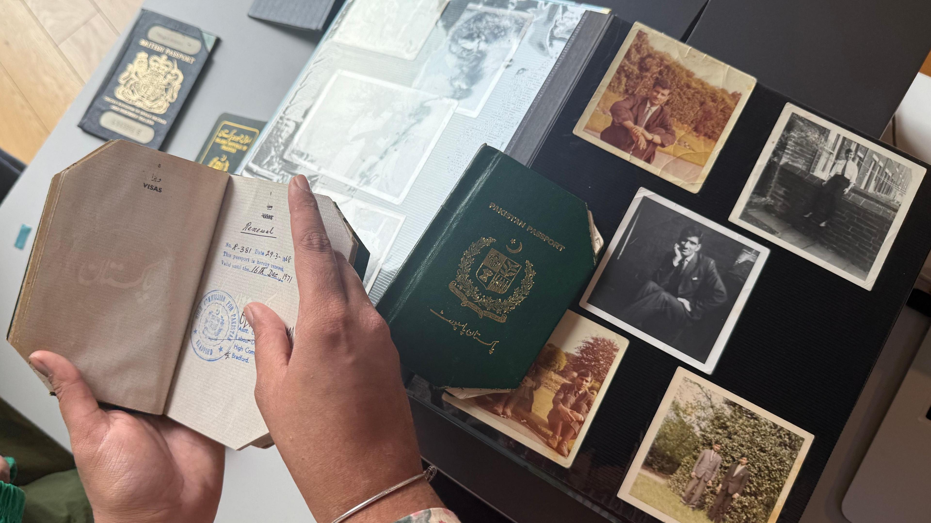 Old passports and photographs of a Pakistani man who moved to Bradford