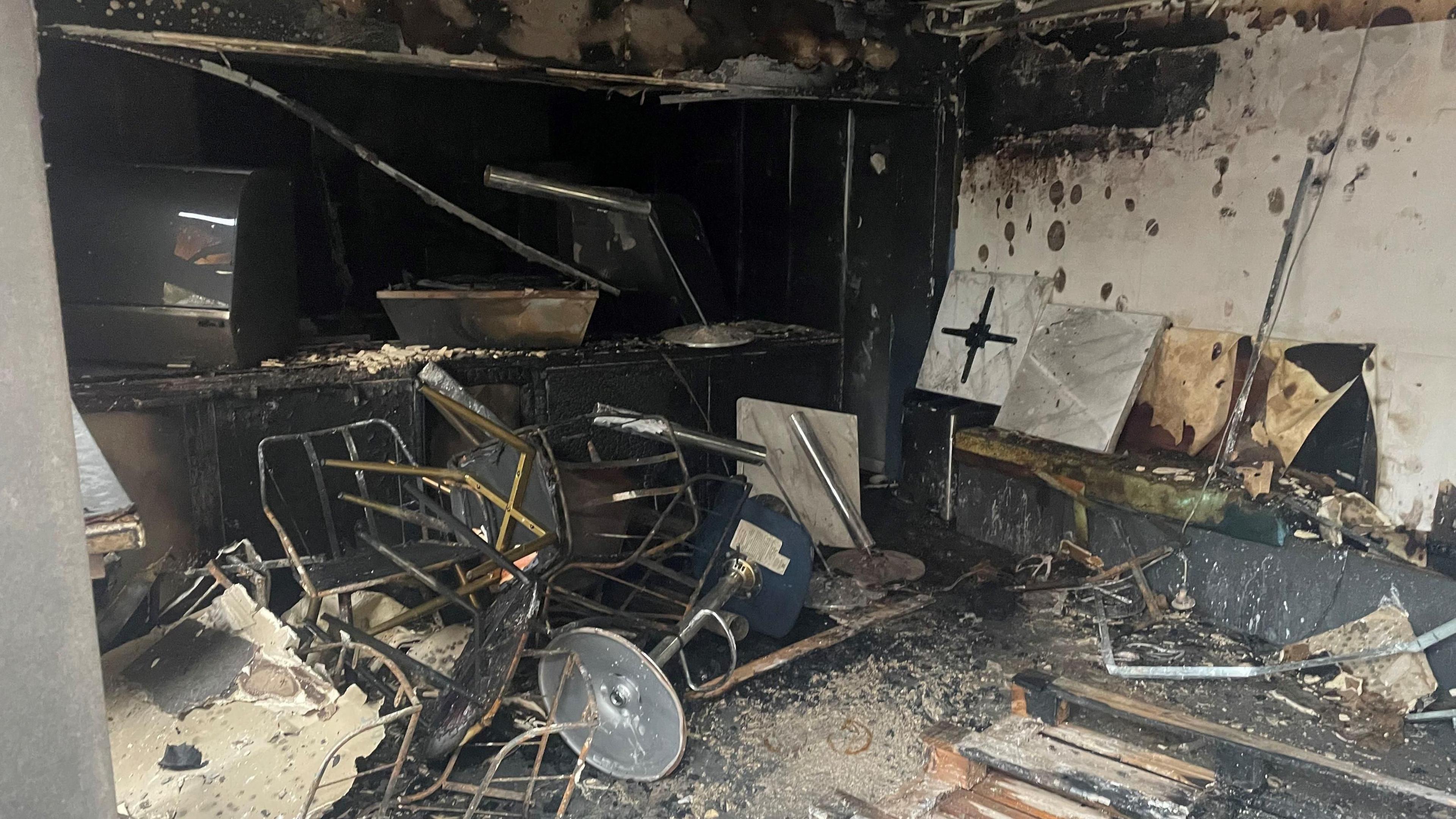 A cafe on the Donegall Road in south Belfast which was destroyed after it was set alight following disorder