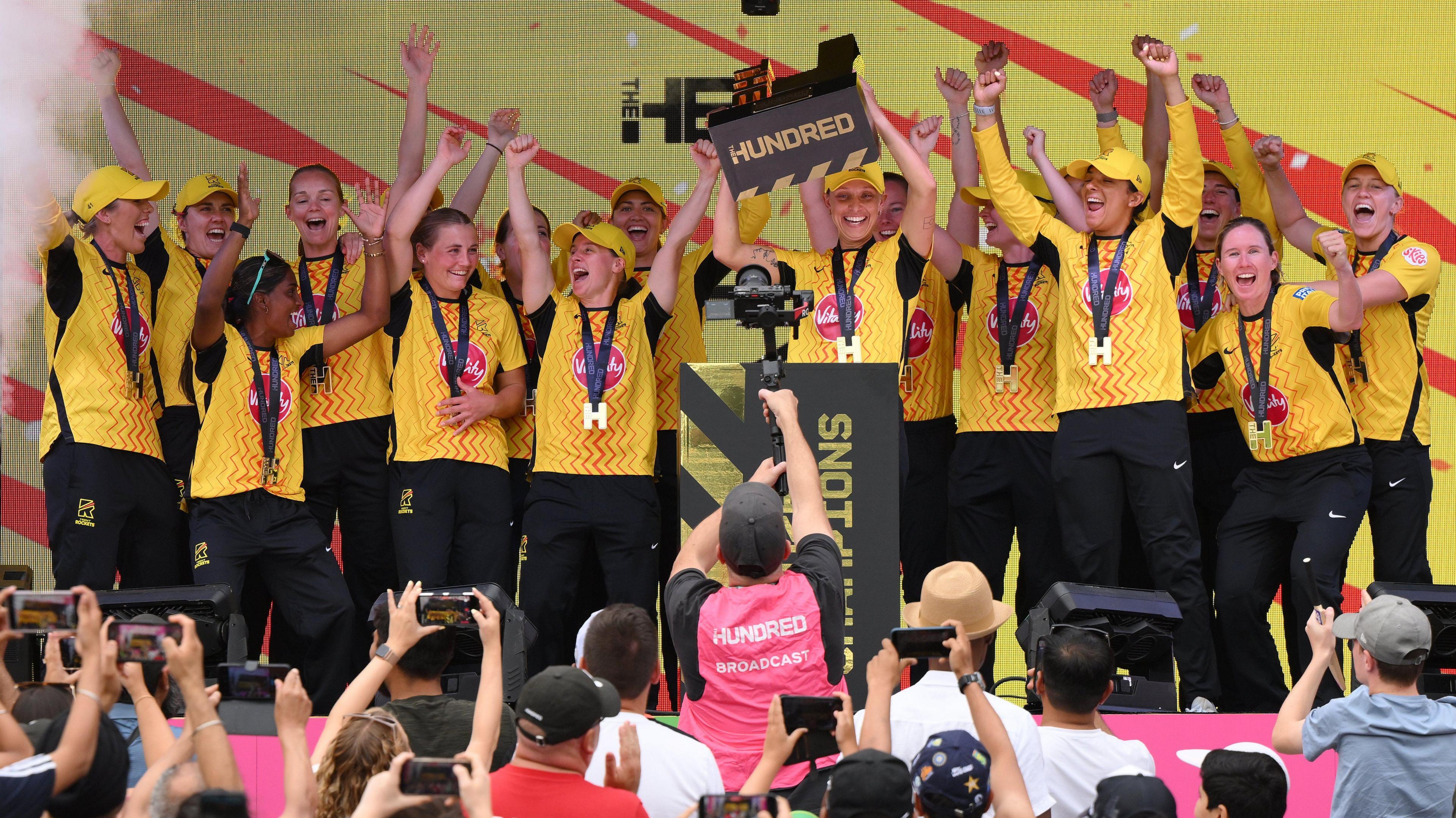 Trent Rockets players lift The Hundred trophy in celebration