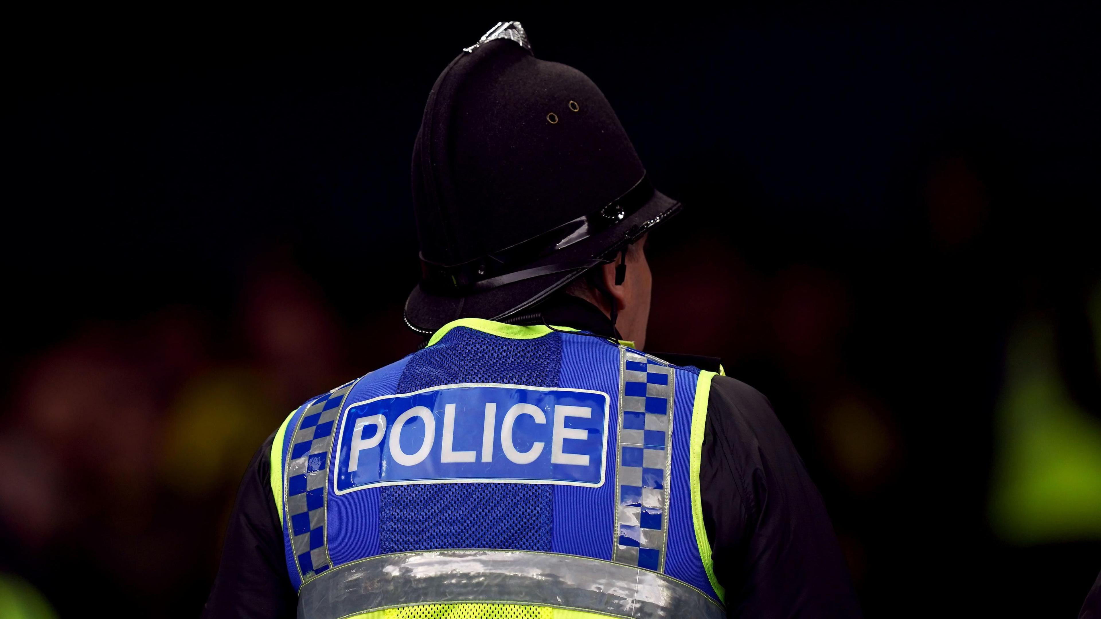 A generic image of a police officer wearing a 'police' vest