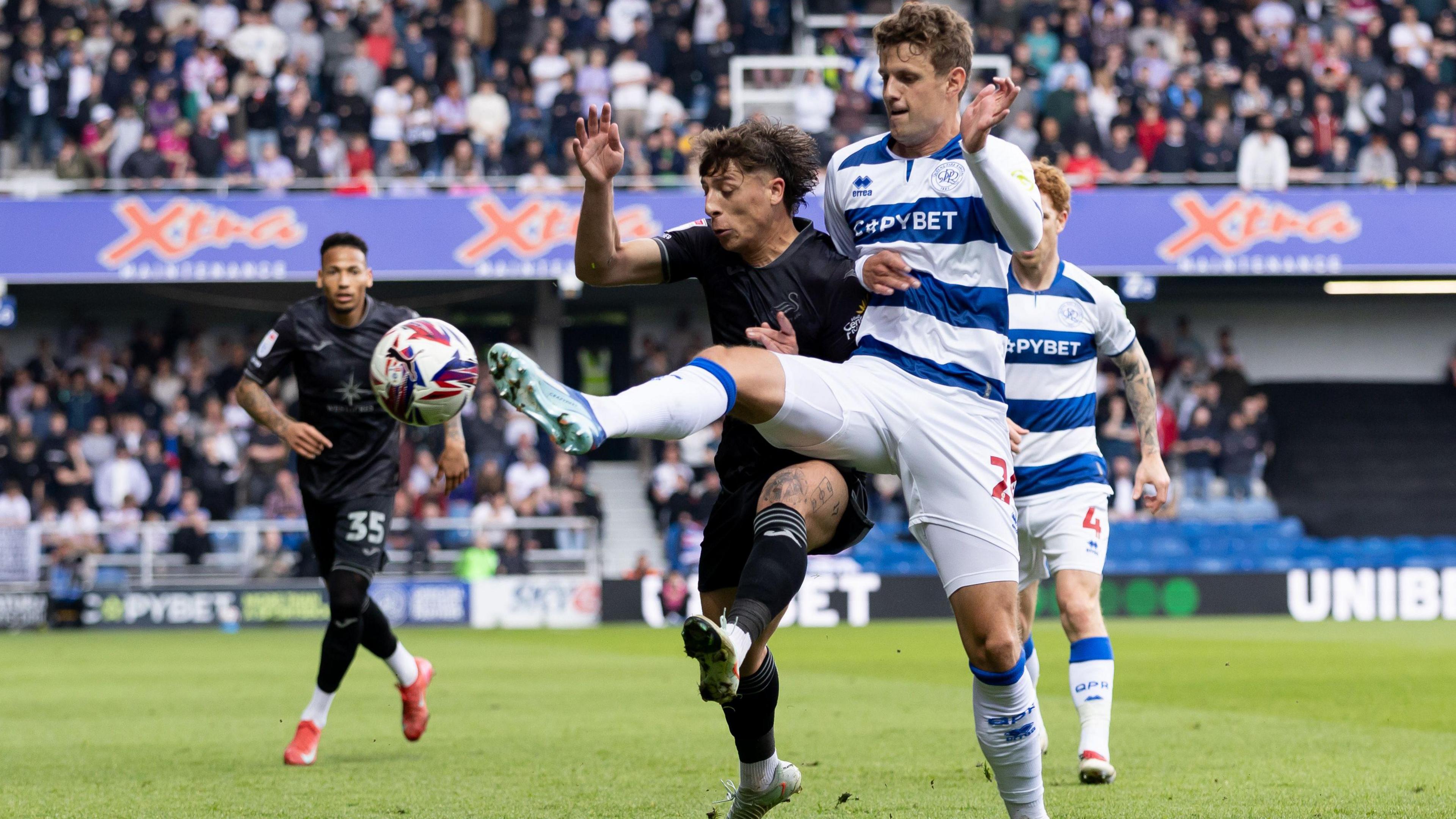 Goncalo Franco fights for possession with Nicolas Madsen