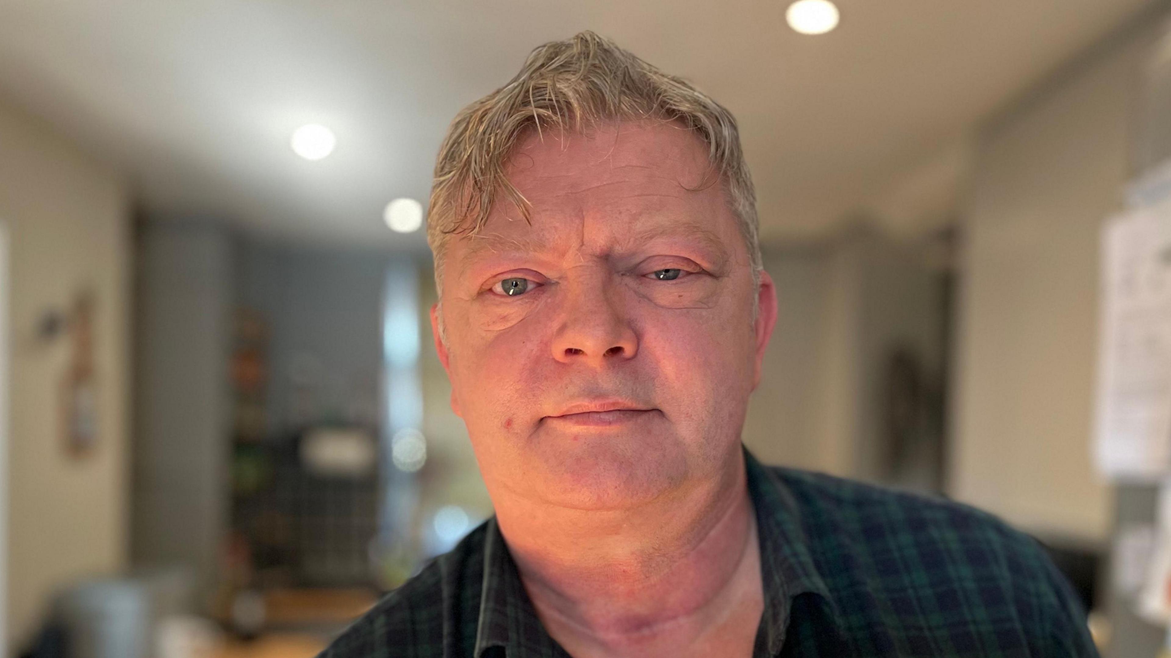 Jason Bayliss, aged 55, in his kitchen