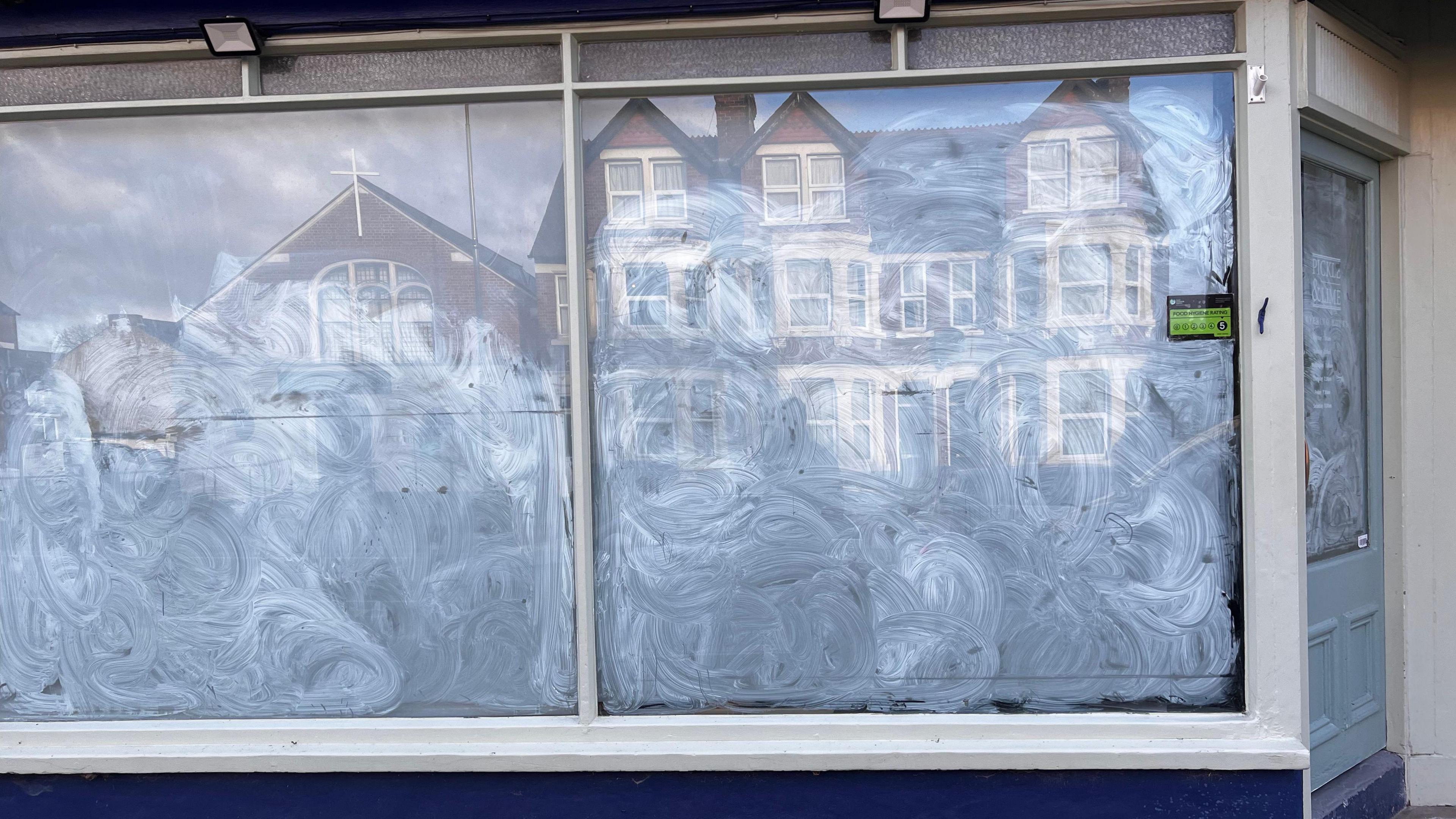 A view of the former Pickle and Lime shop on Botley Road with opaque film on the windows.