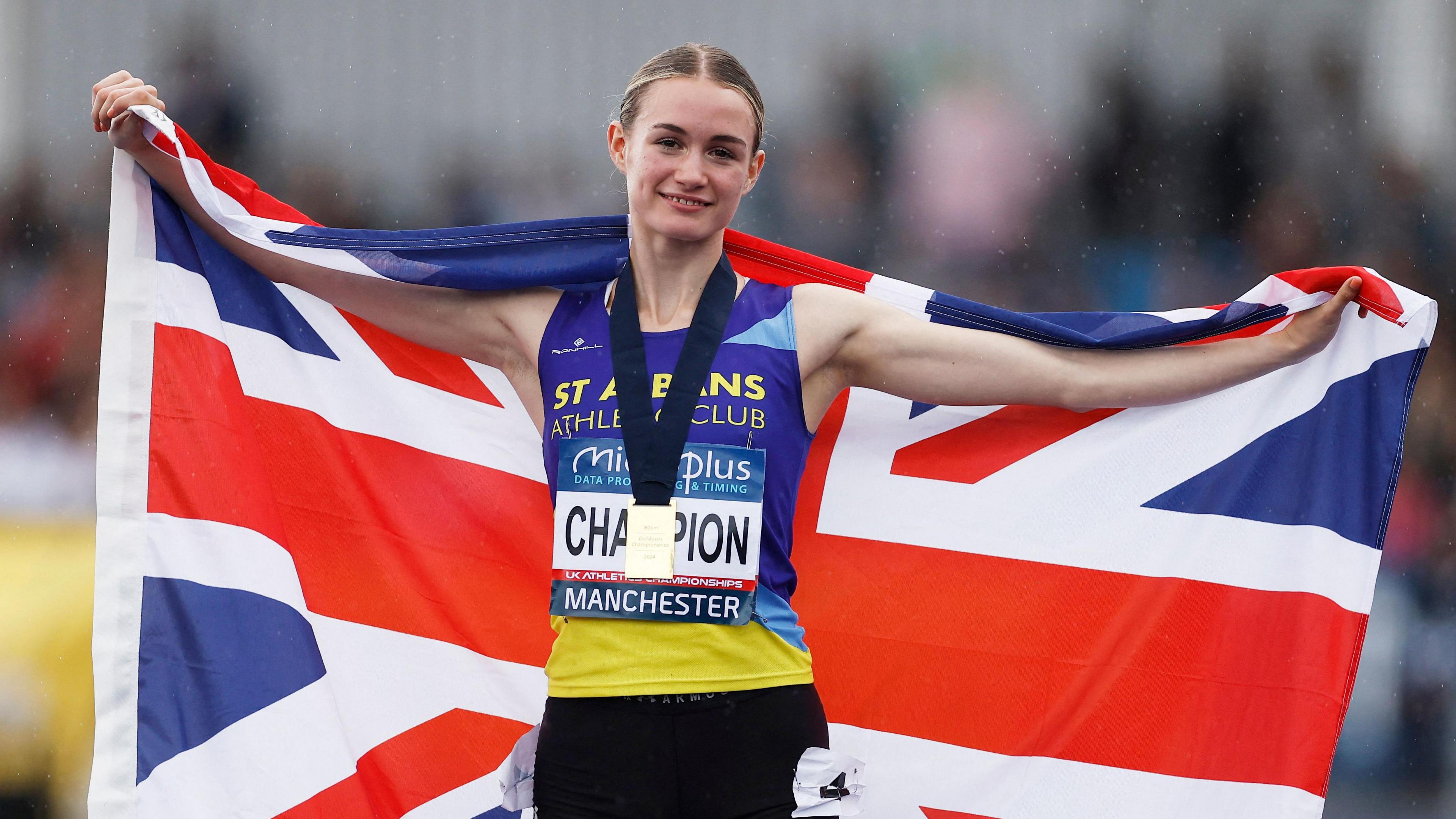 Britain's Phoebe Gill celebrates with her national flag after winning the women's 800m 