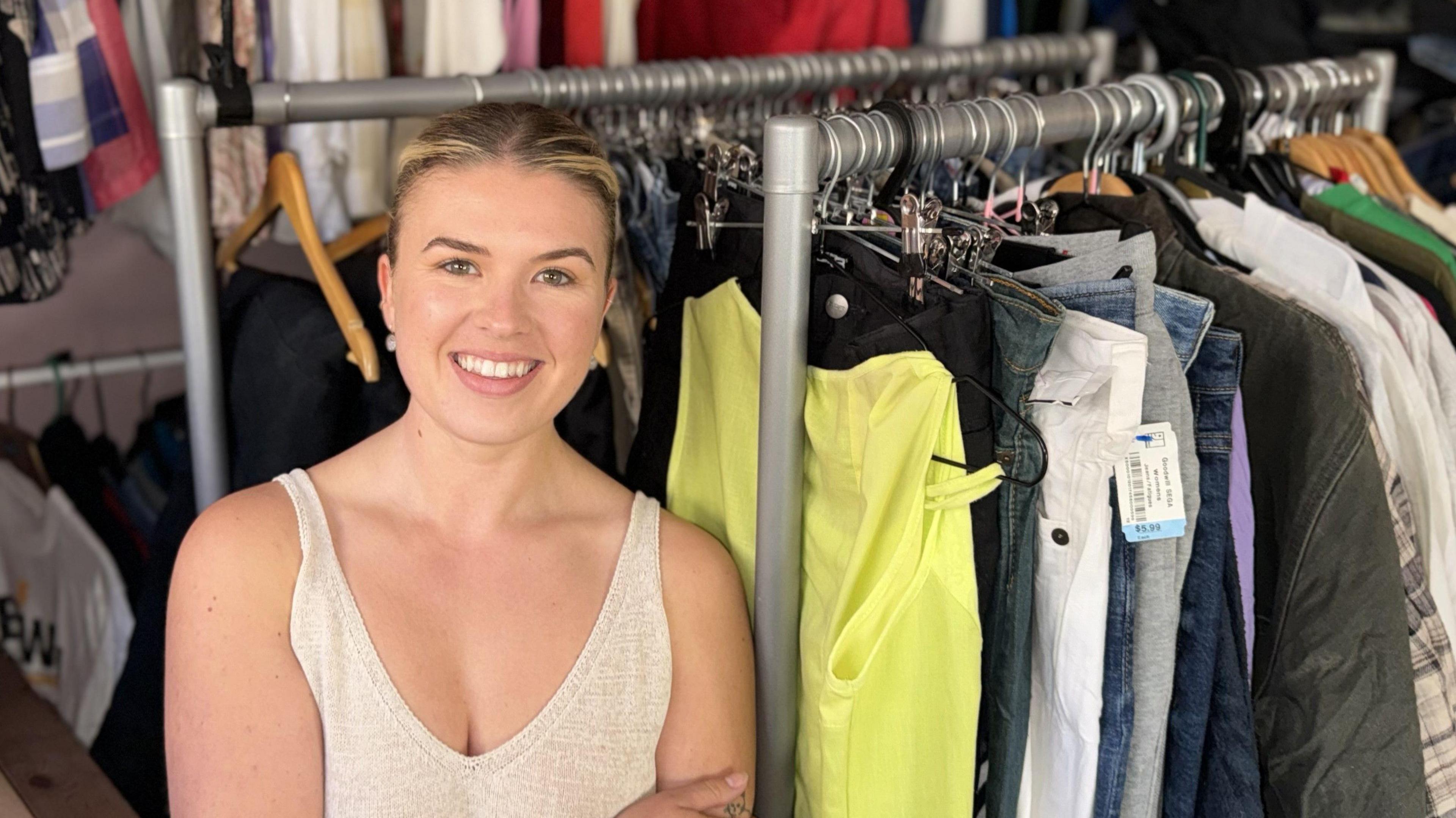  Sam Eastcott in front of clothing rack