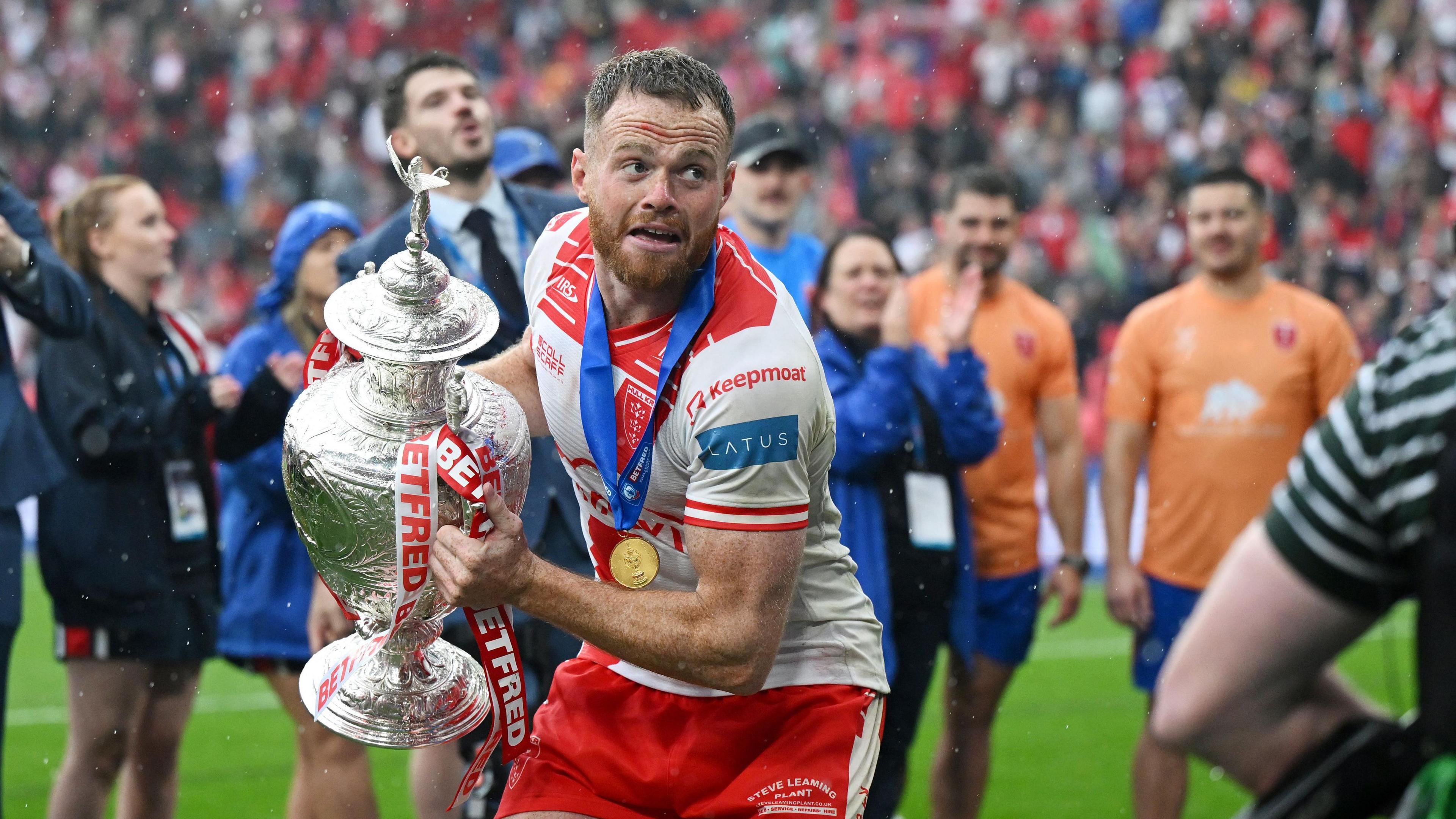 Joe Burgess holding the Challenge Cup