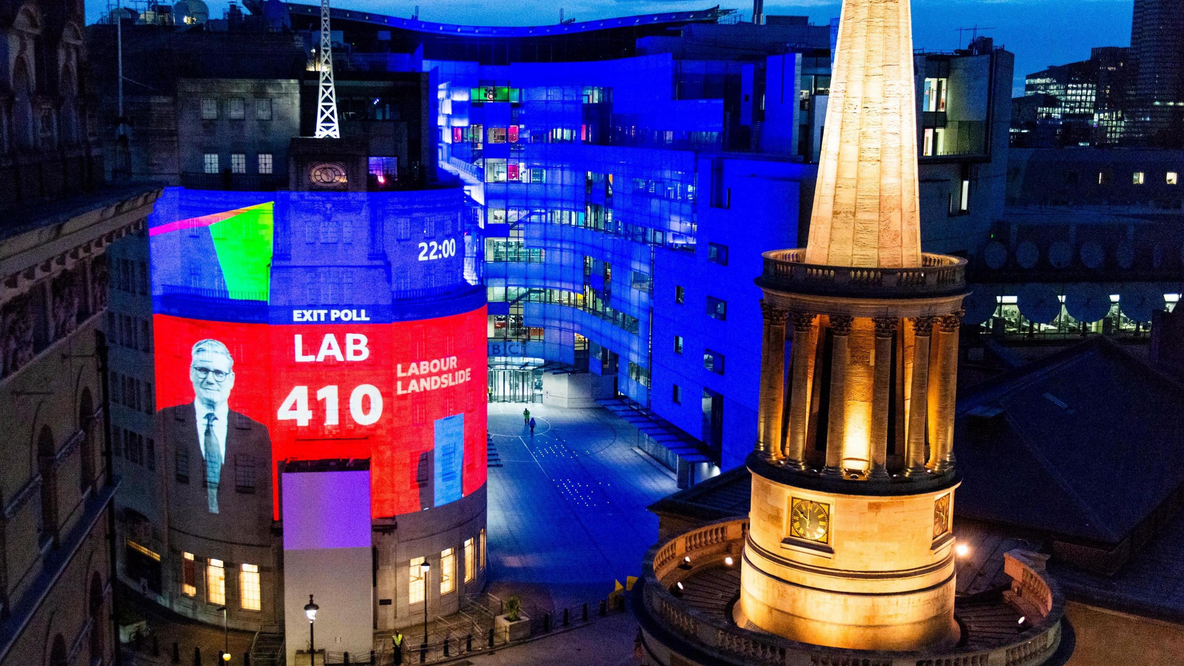 The front of the BBC headquarters building has a picture of keir starmer projected on it, showing the exit poll which suggests a Labour landslide.