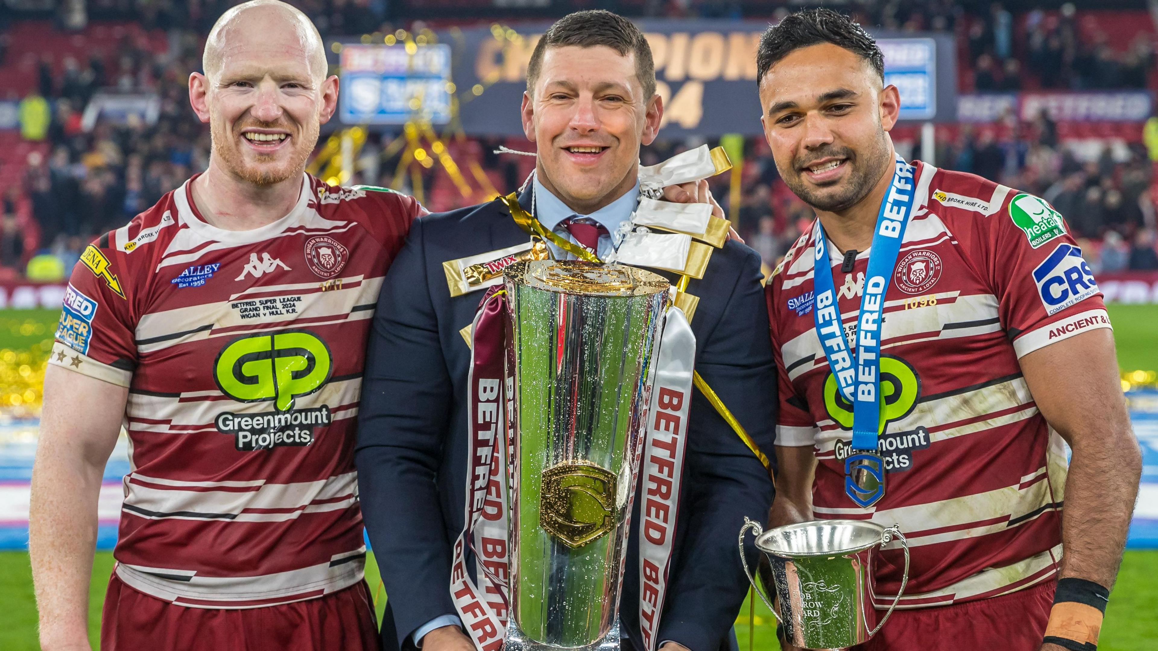 Liam Farrell and Bevan French celebrate their Grand Final victory with head coach Matt Peet