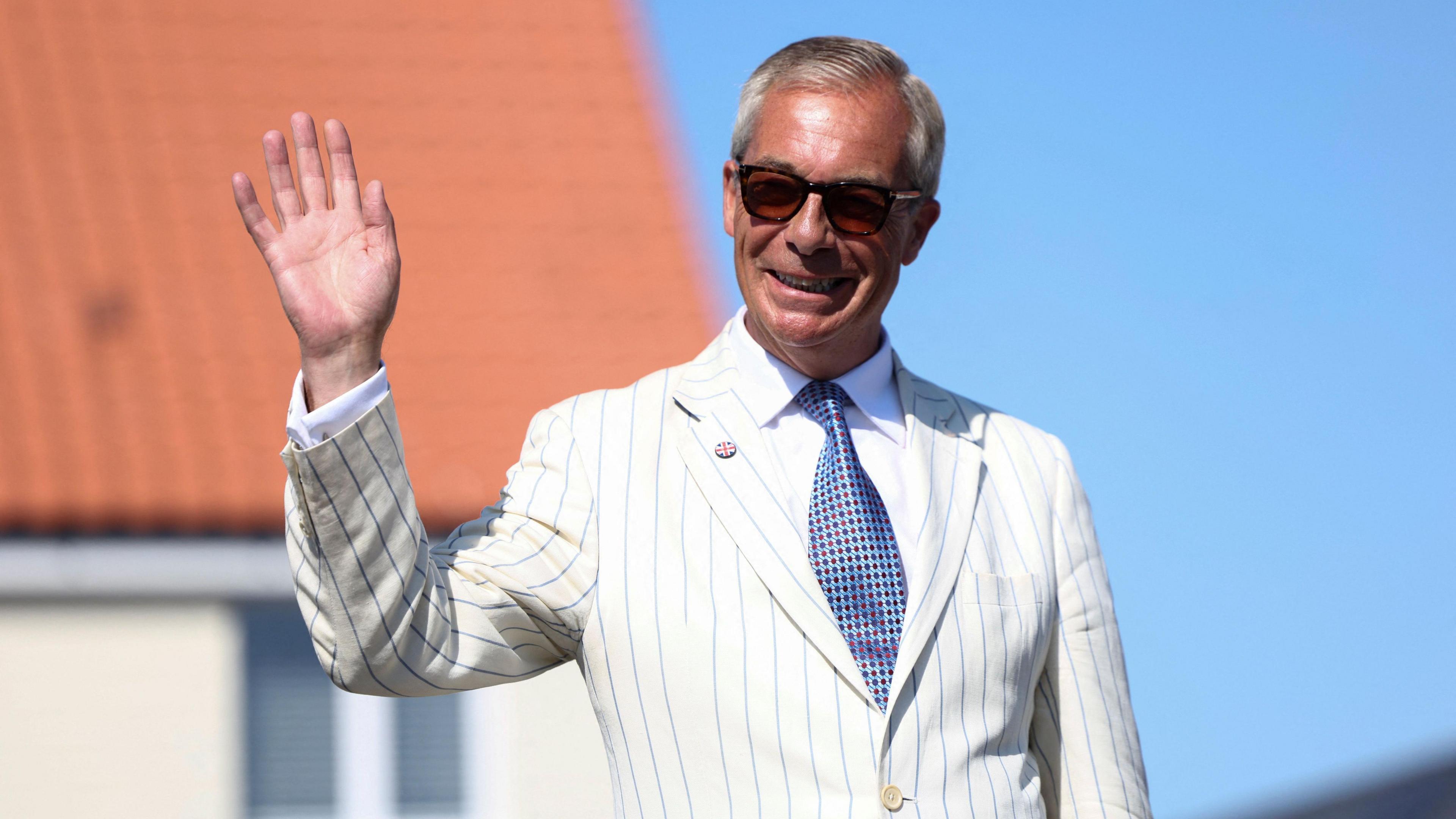 Britain's Reform UK party leader Nigel Farage arrives at his polling station for the Clacton by-election, triggered by his own resignation, in Walton-on-the-Naze, Essex, Britain, August 13, 2026. REUTERS/Toby Shepheard
