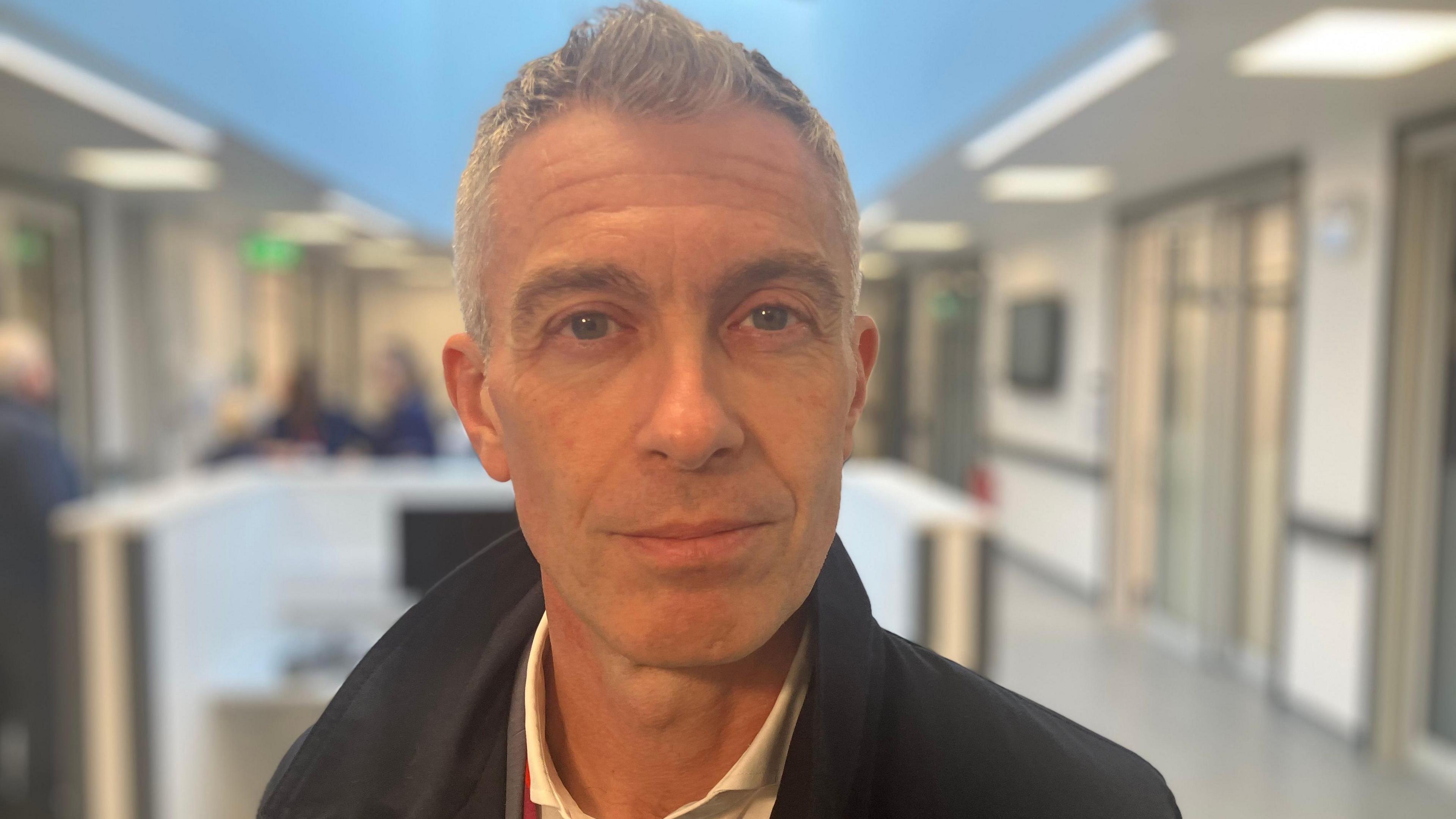 Simon Barton looking at the camera. He is at the new £18m endoscopy centre at Leicester General Hospital.