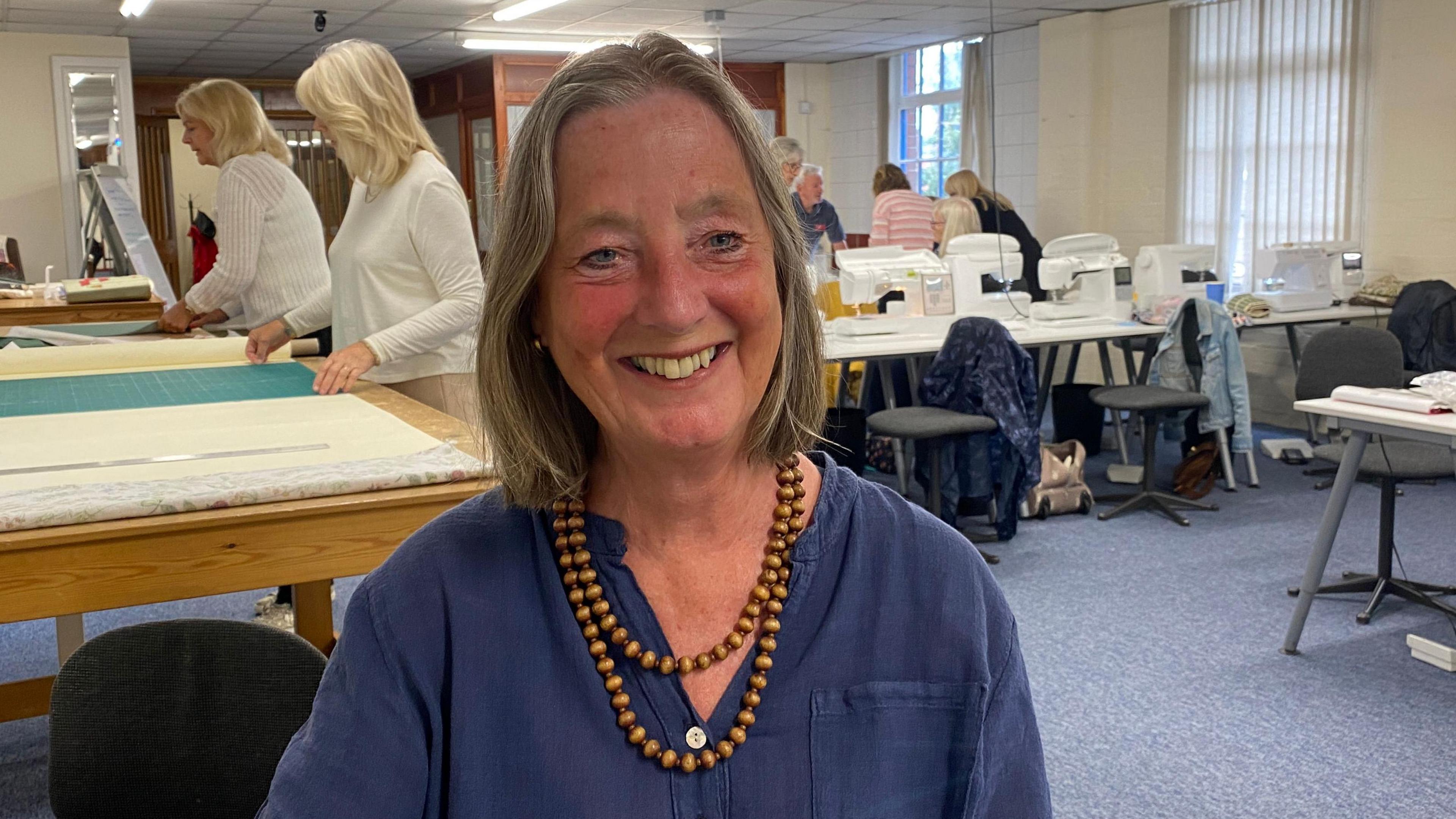 Gill Davidson sits in a sewing room at her class in Nottingham.