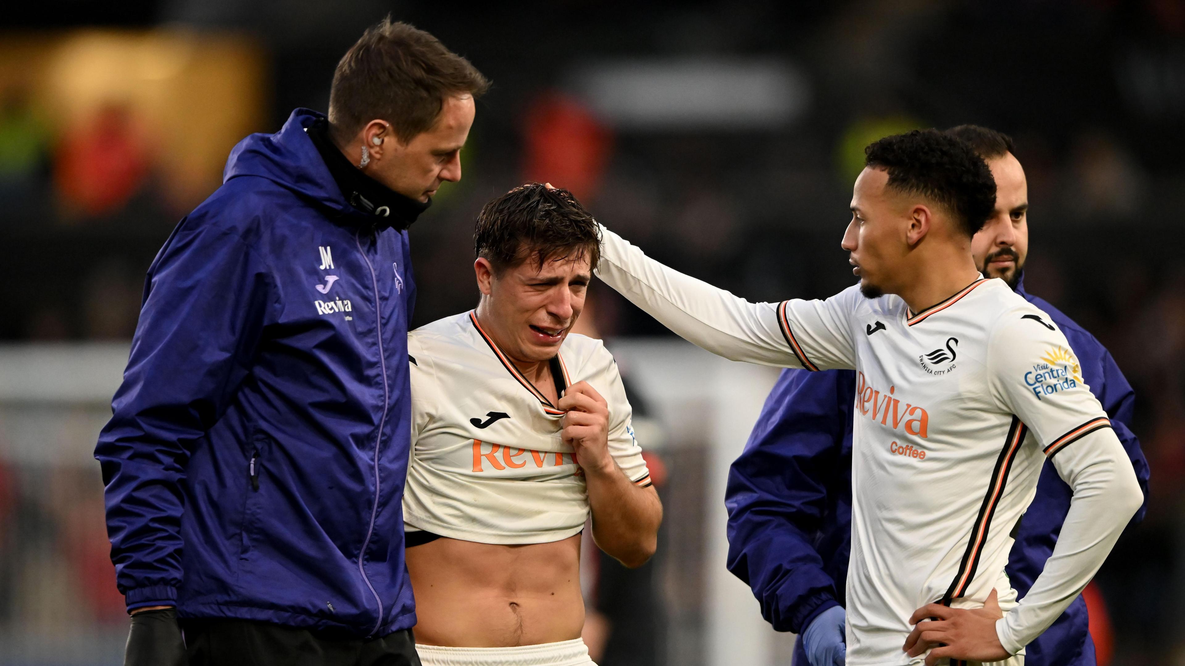 Goncalo Franco cries as he leaves the field during Swansea's game with Luton 