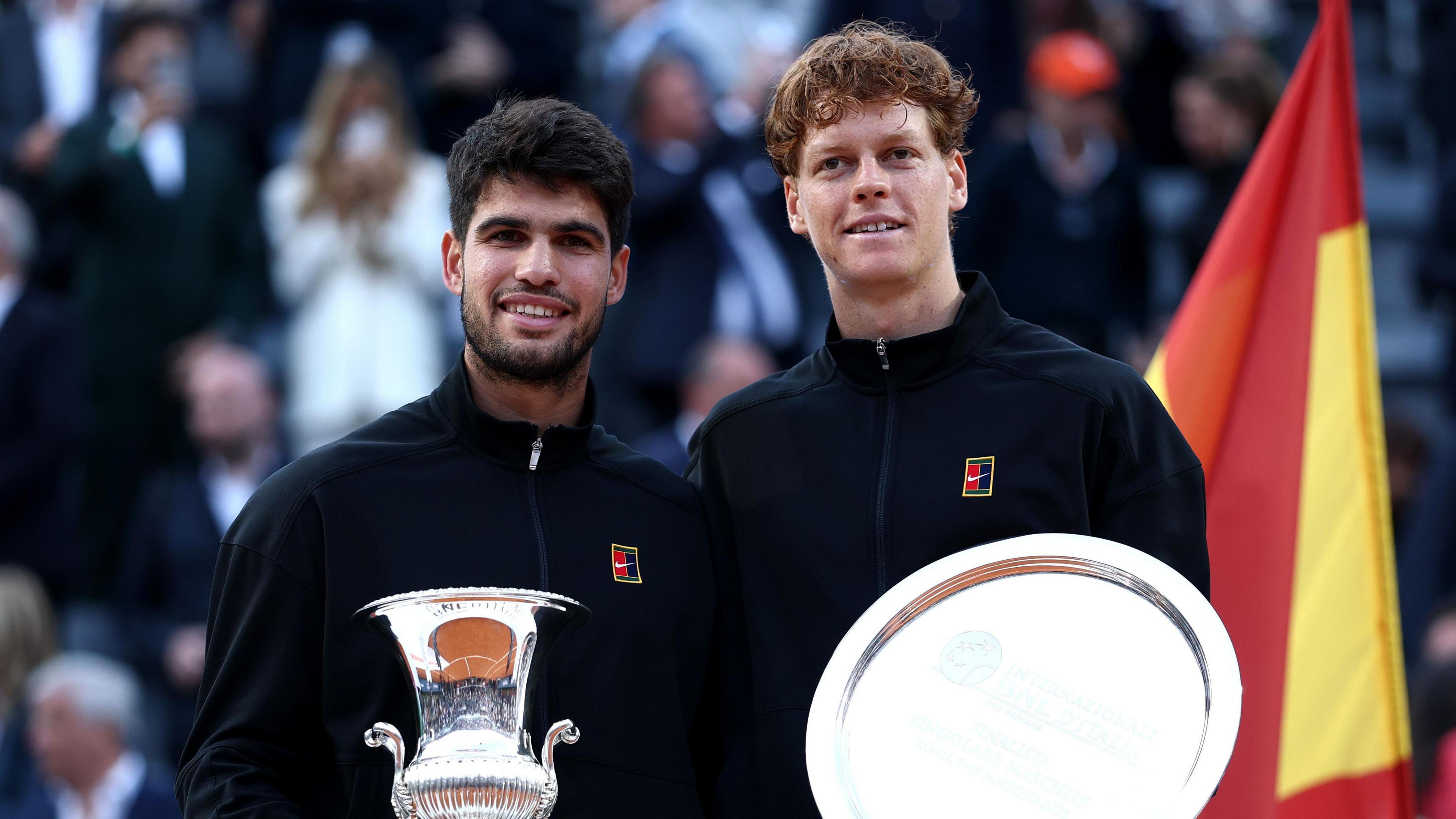 Carlos Alcaraz and Jannik Sinner pose with their Italian Open trophies