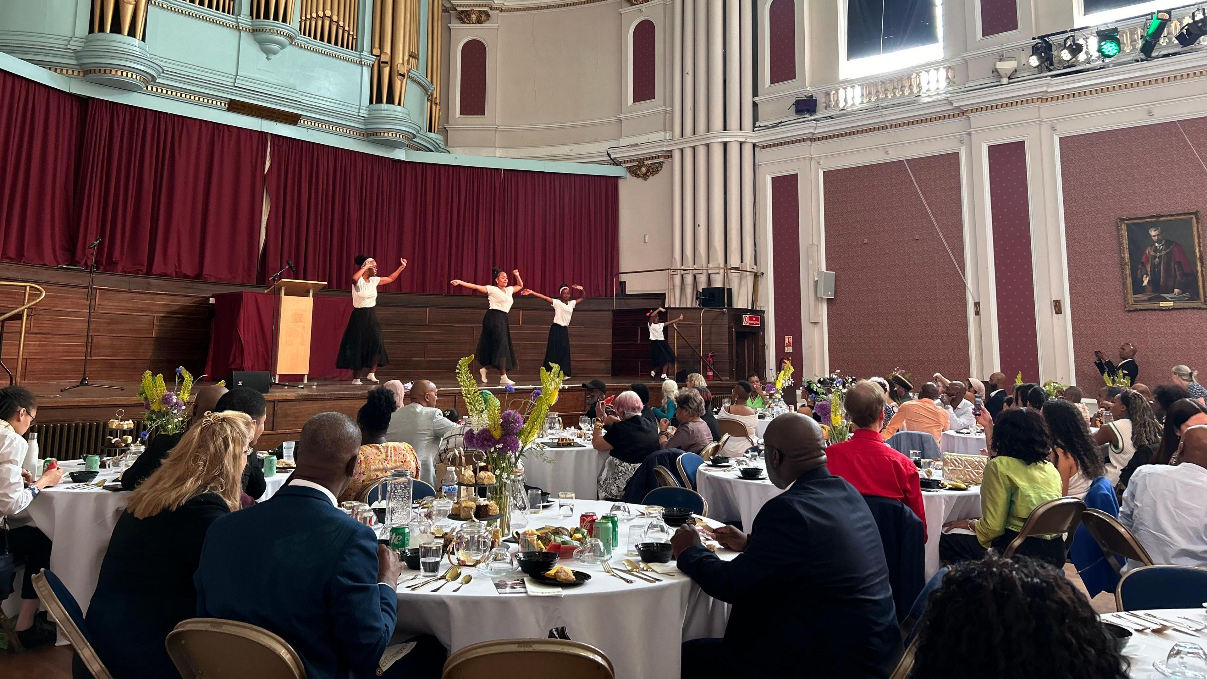 People attending a Windrush Stories and Caribbean Tea Party in Cambridge