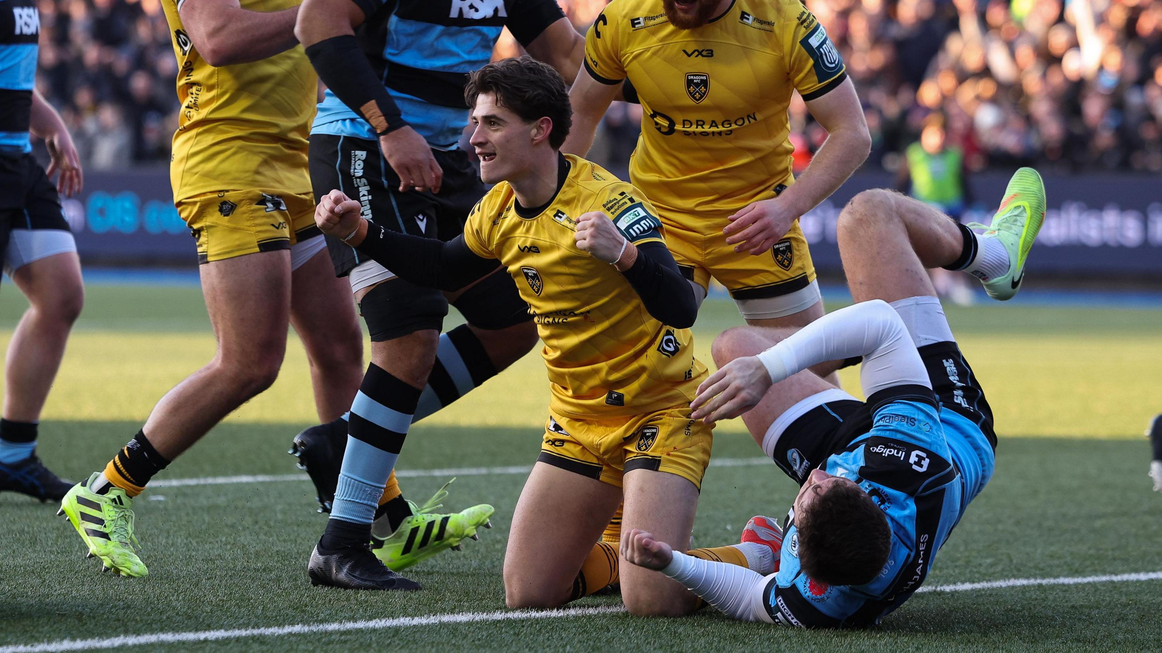 Che Hope celebrates scoring for Dragons at Cardiff in the URC