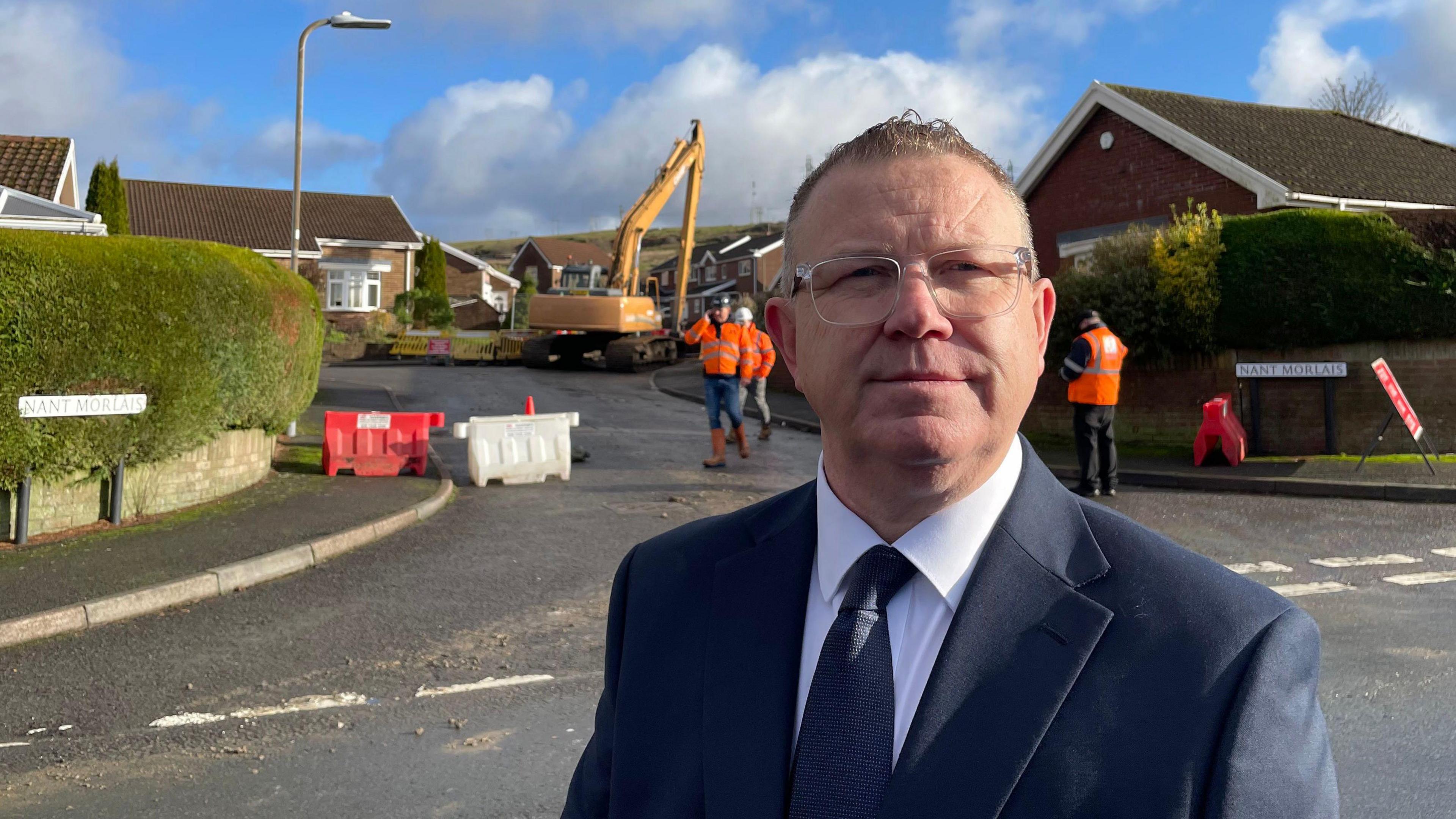 Merthyr Tydfil council leader Brent Carter on Nant Morlais in Pant, Merthyr Tydfil, where a sinkhole continues to open up having forced residents to be evacuated