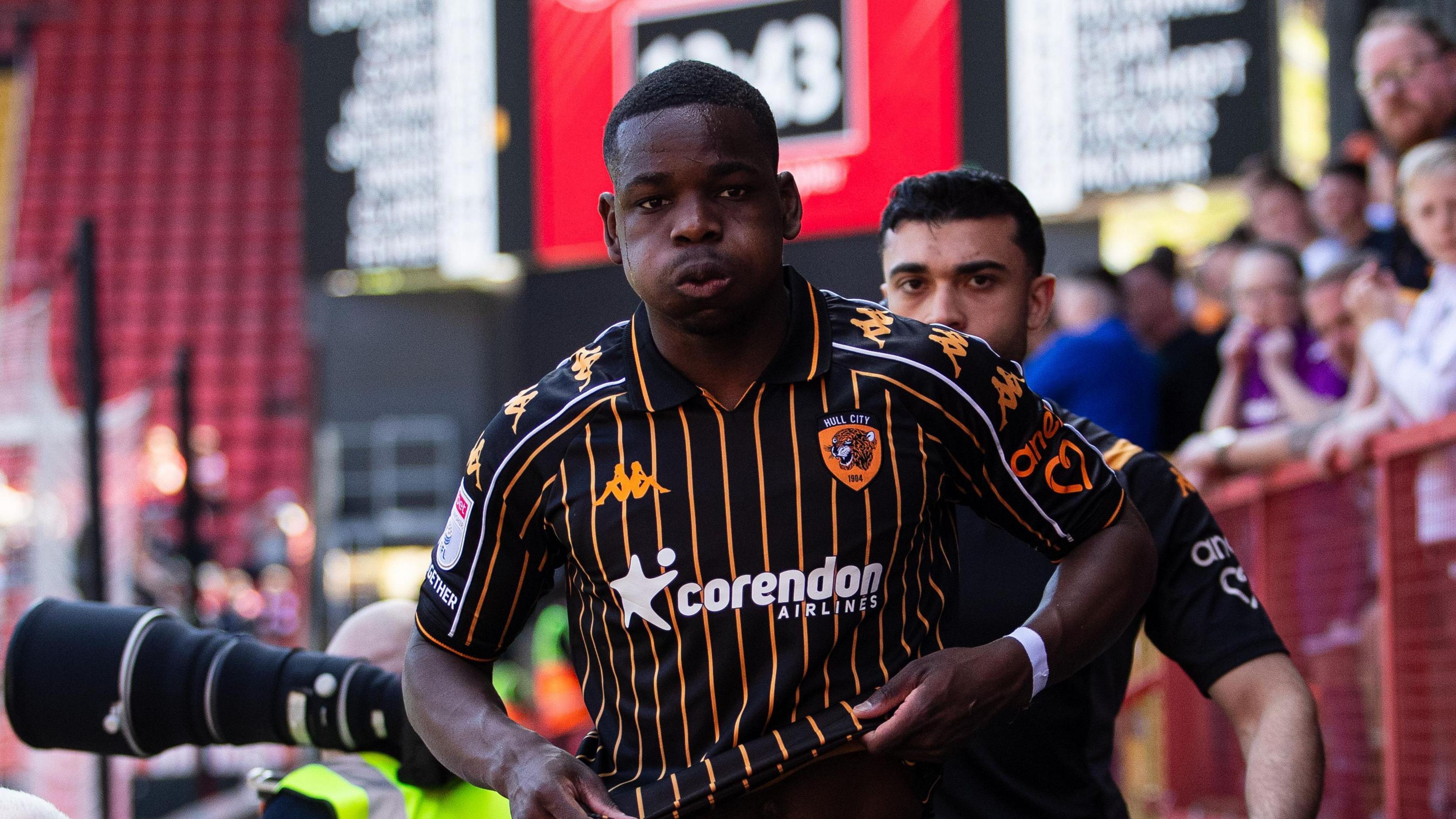 Eliot Matazo going off on the side of the pitch after being substituted at Charlton