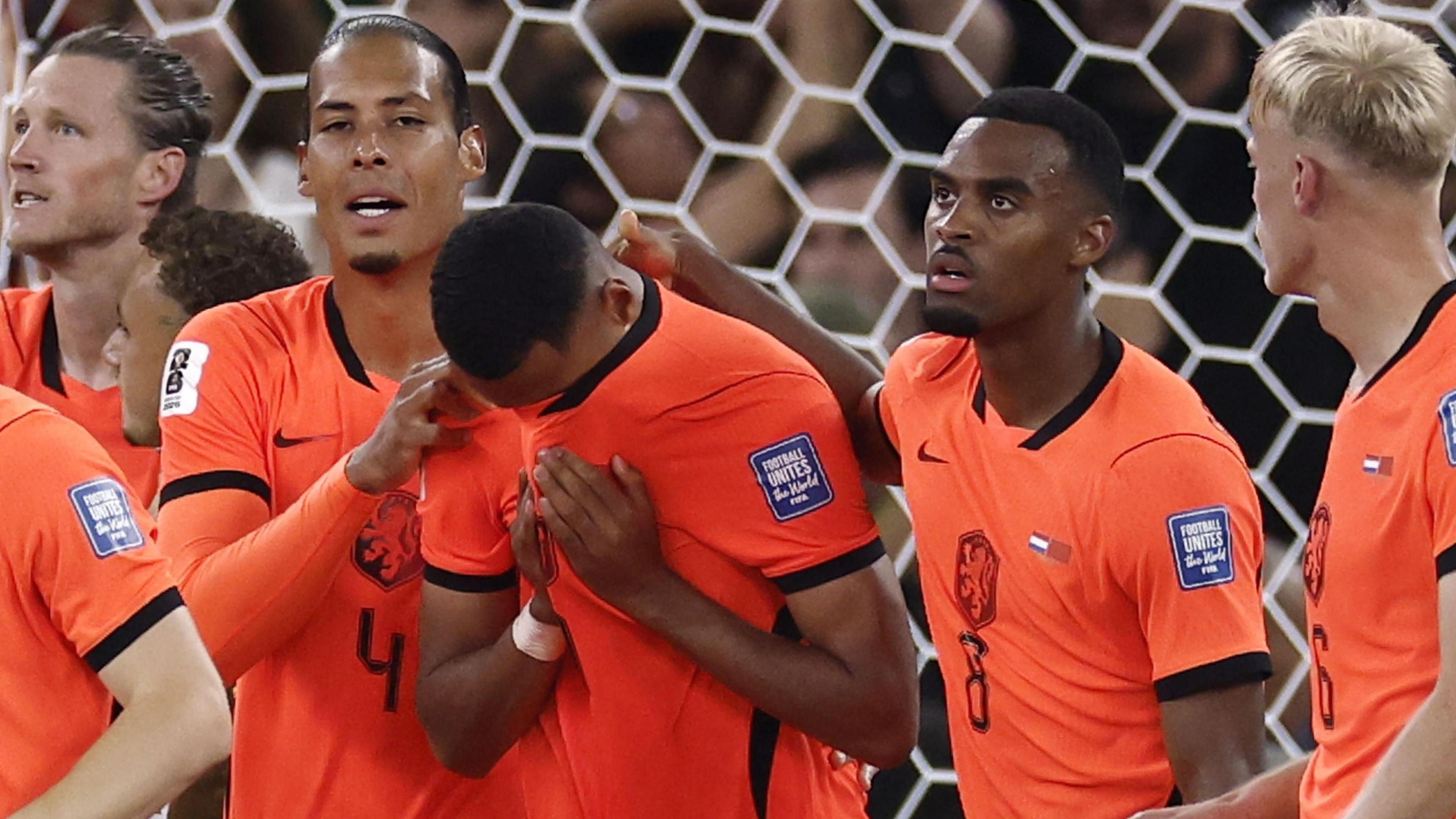 Netherlands players embrace Cody Gakpo after he scores against Morocco