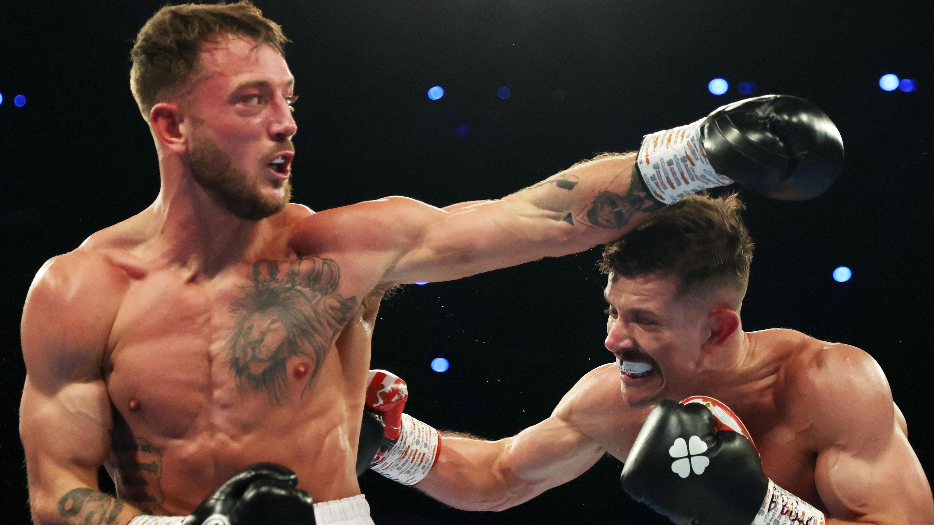 Brad Pauls (left) fights Nathan Heaney 