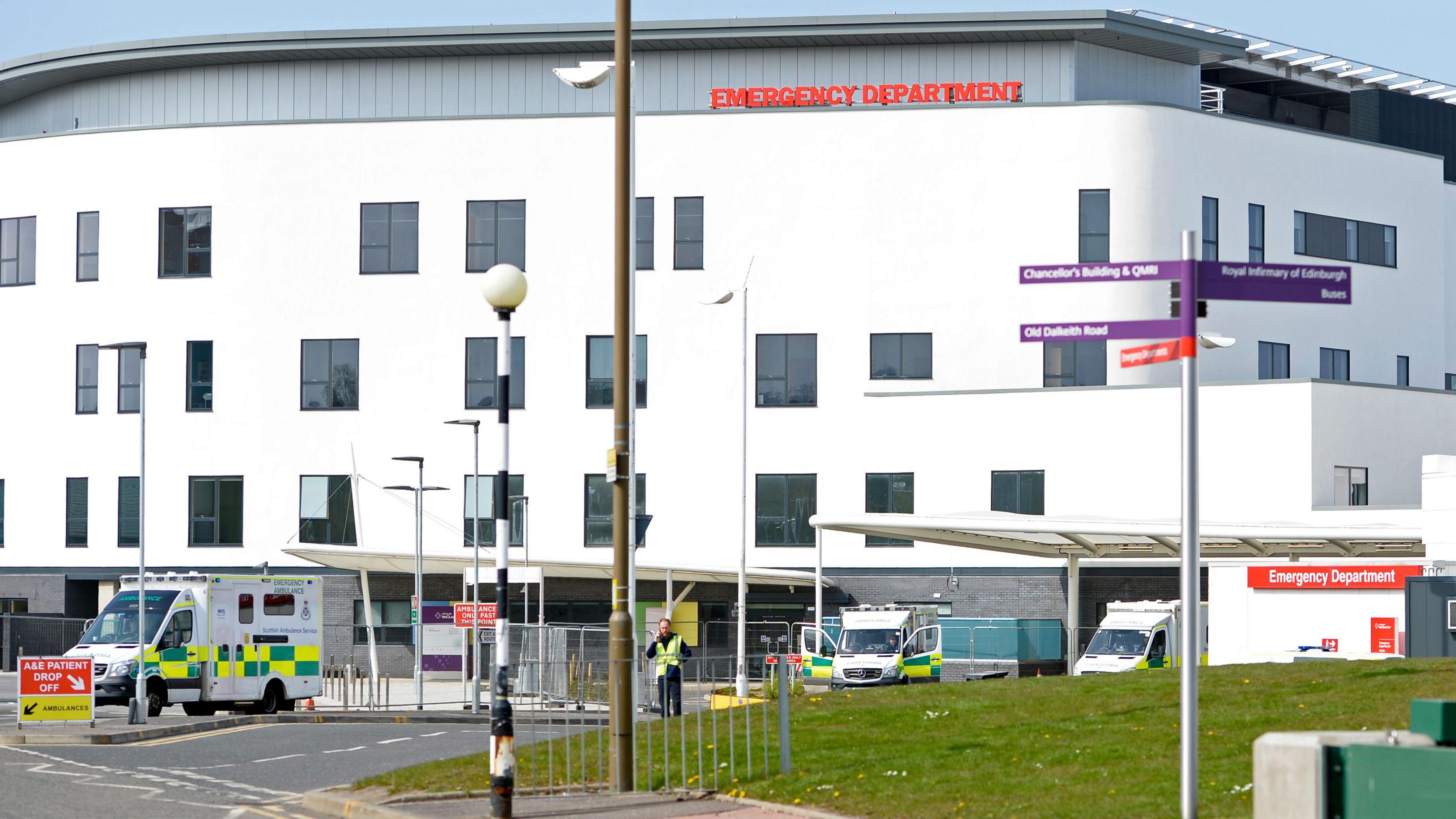 A general view of the Royal Infirmary of Edinburgh hospital, with ambulances visible that are parked in front.