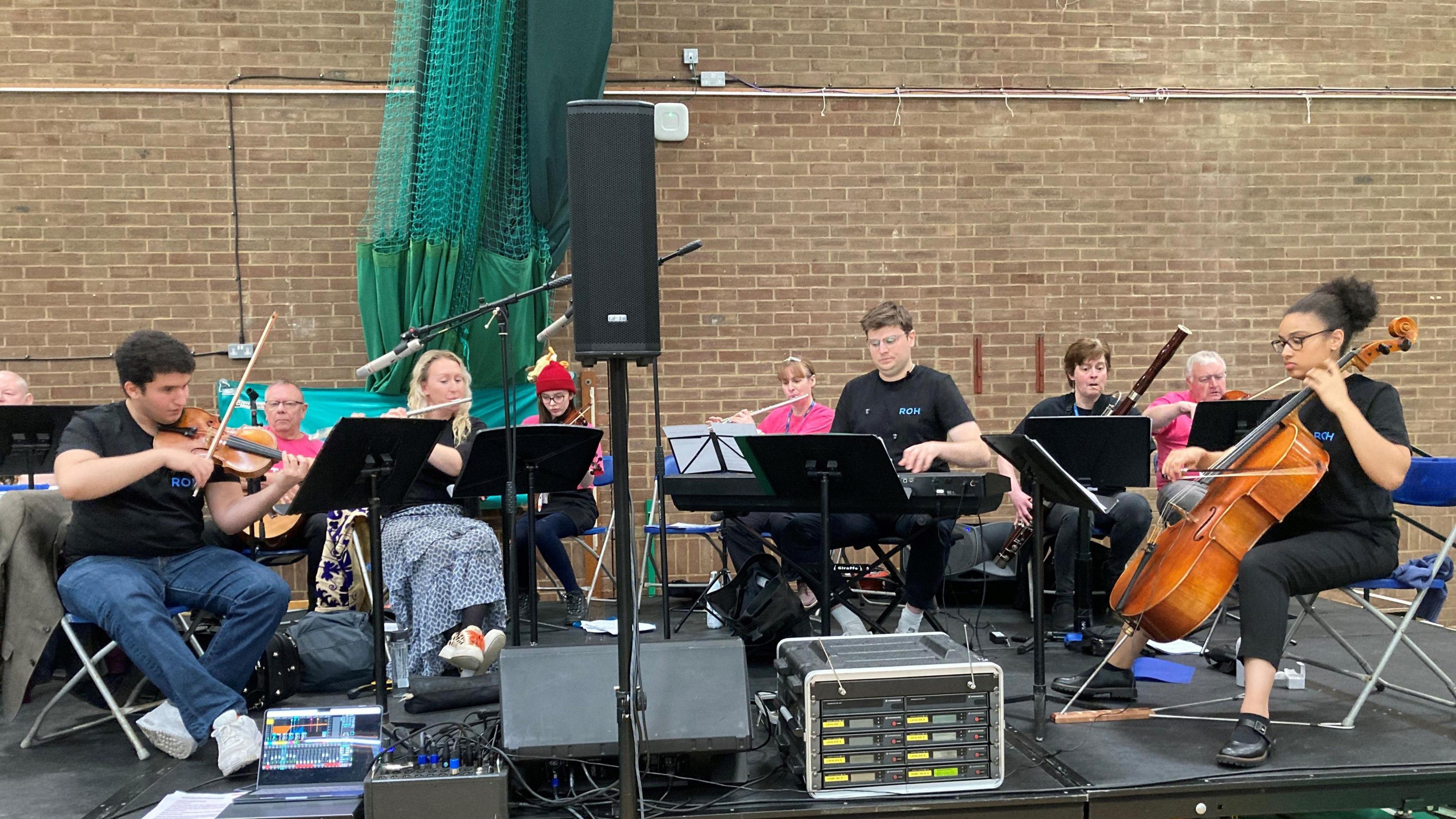 Musicians from the Royal Opera House playing on the stage.