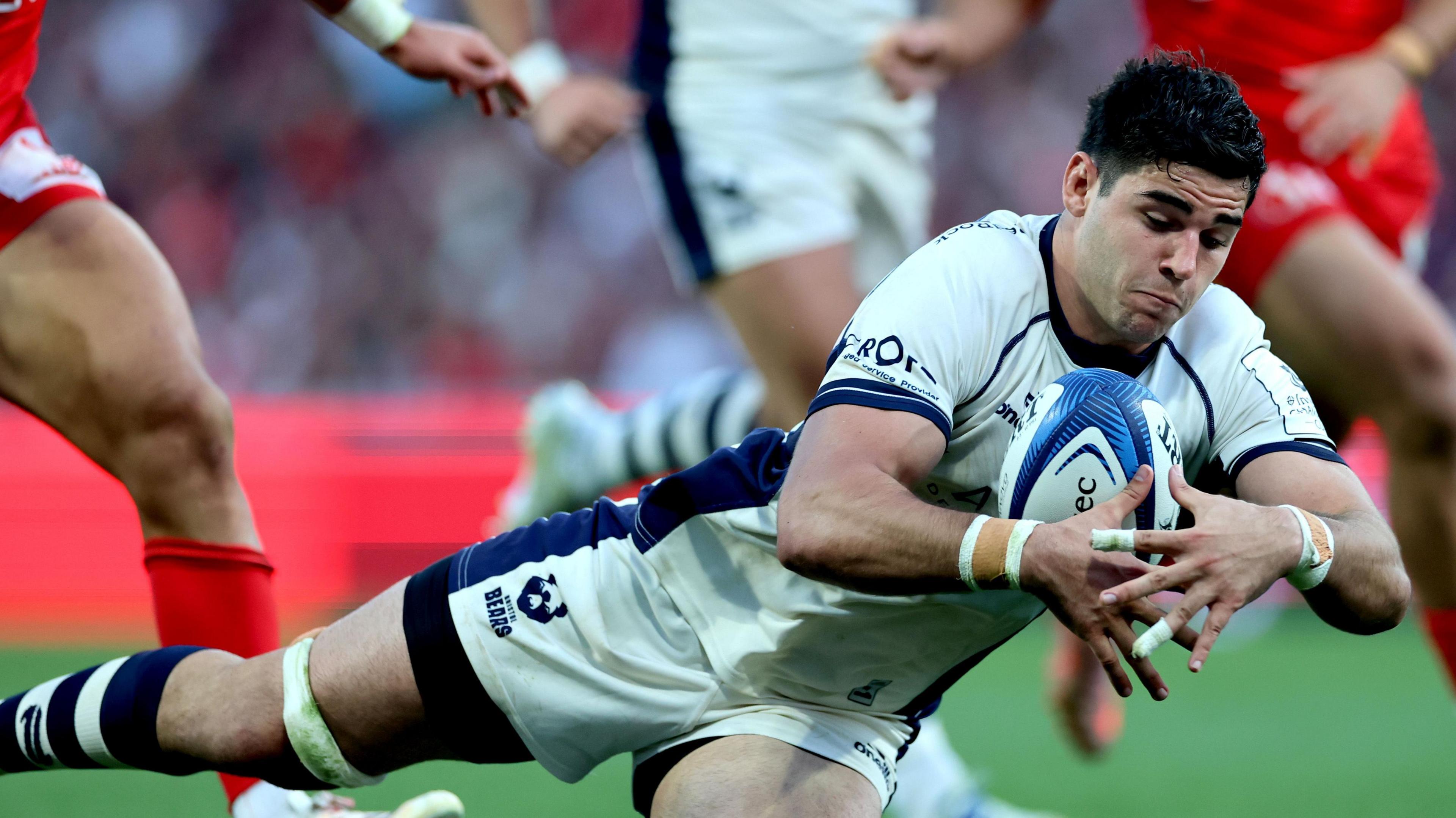 Bristol Bears back row Santiago Grondona dropping to the ground to score a try.