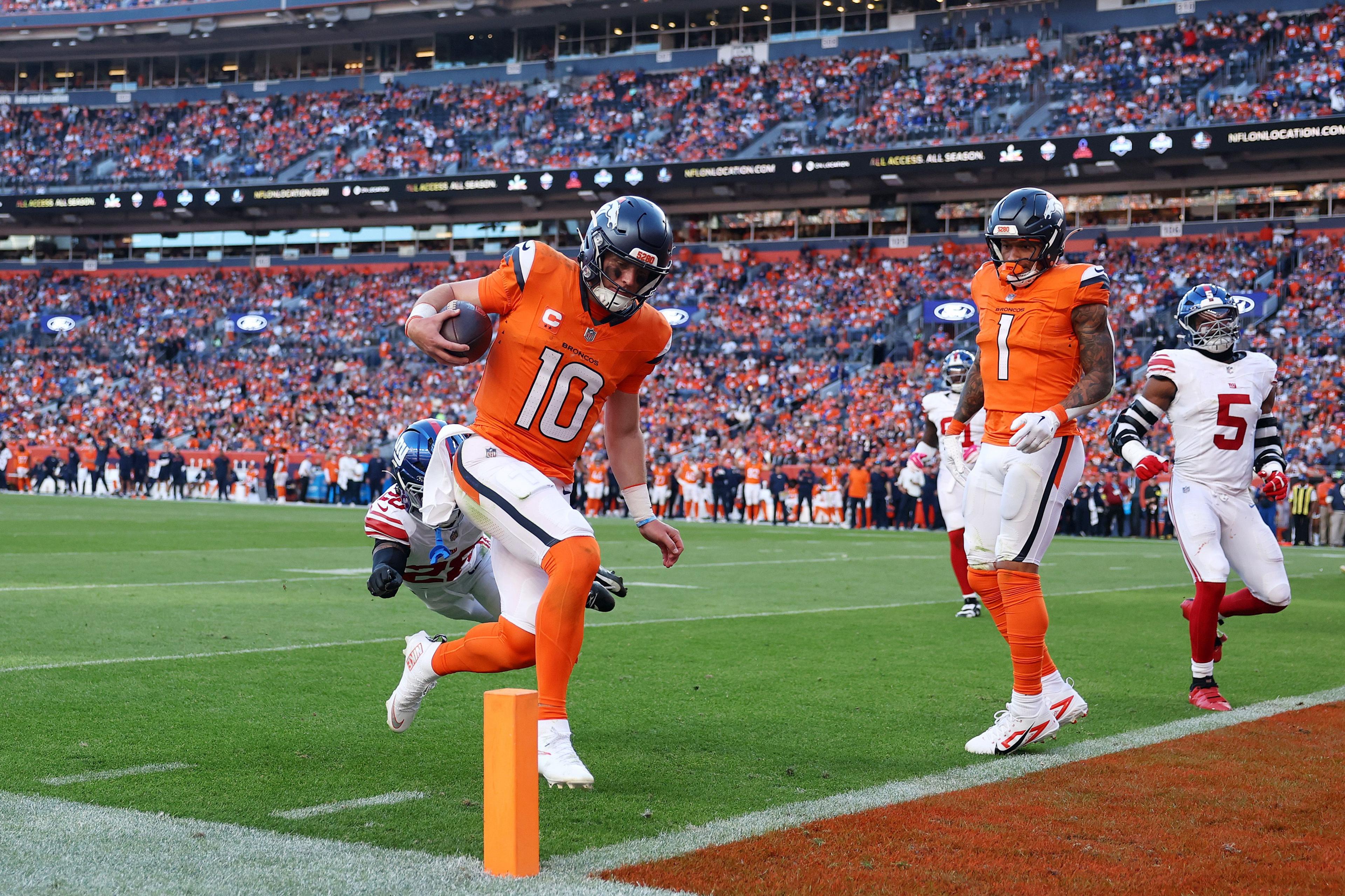 Bo Nix of the Denver Broncos scores a touchdown