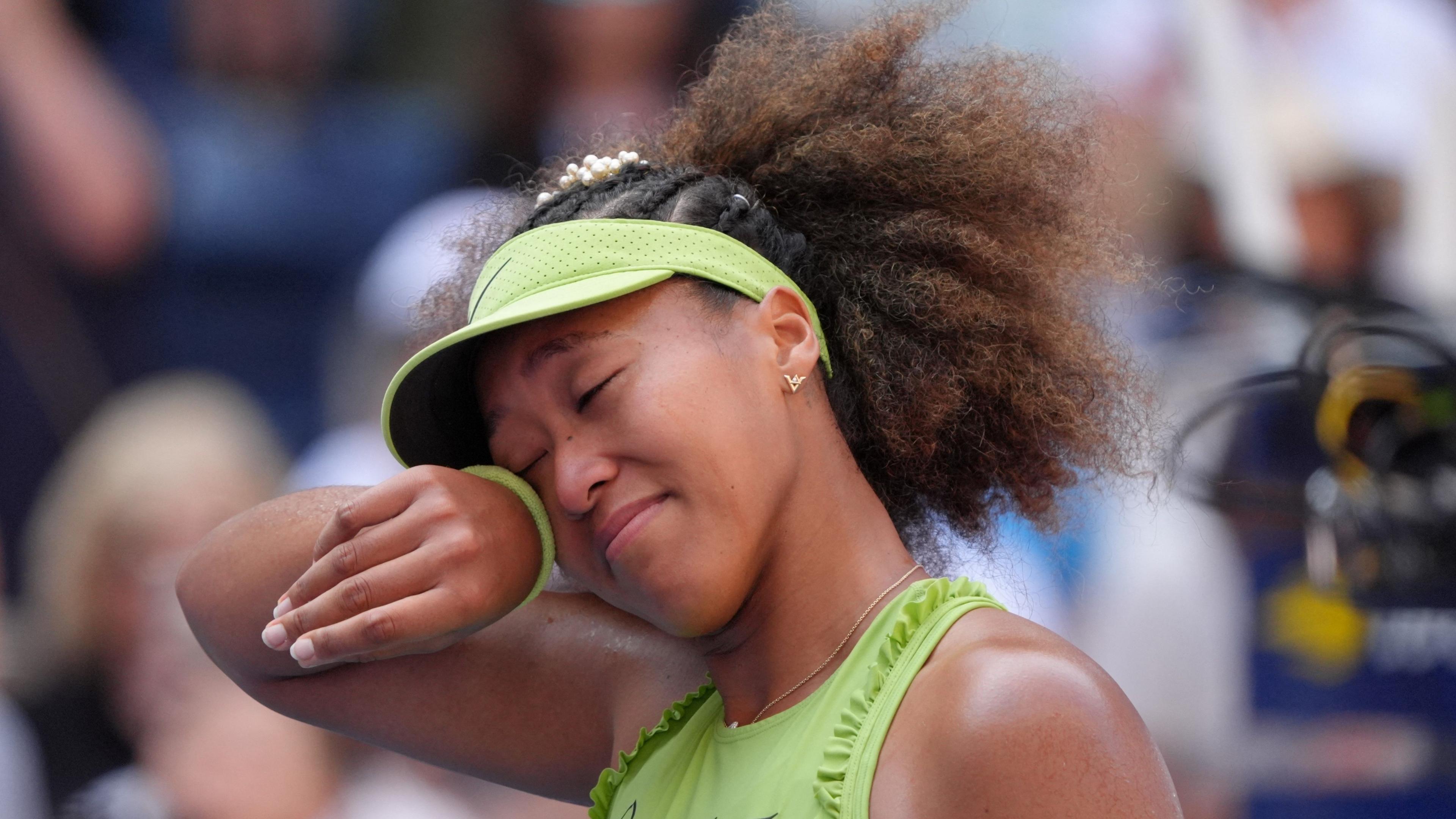 Naomi Osaka wipes away a tear at the US Open