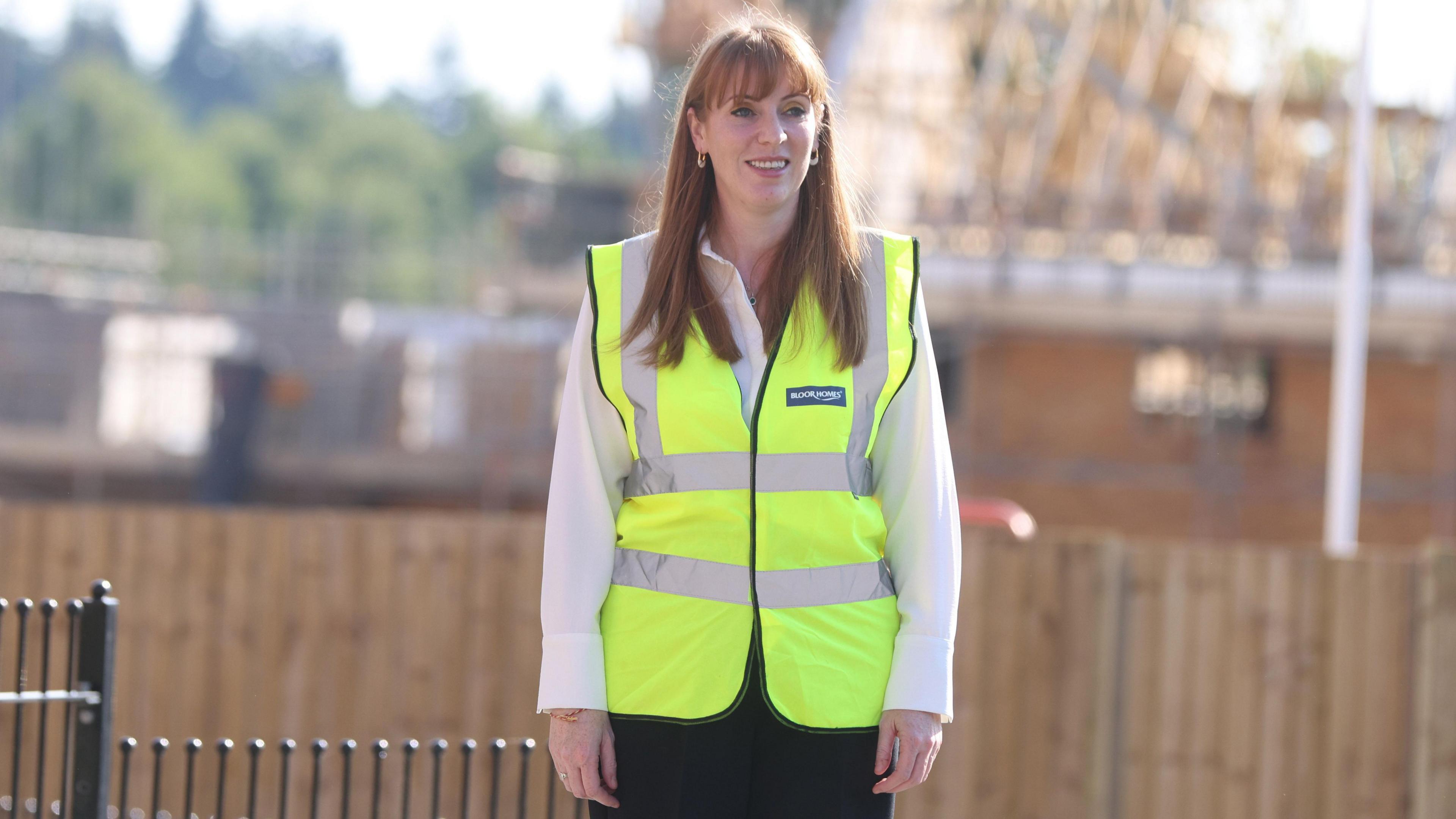 Angela Rayner wearing a hi-vis jacket during a visit to a building site