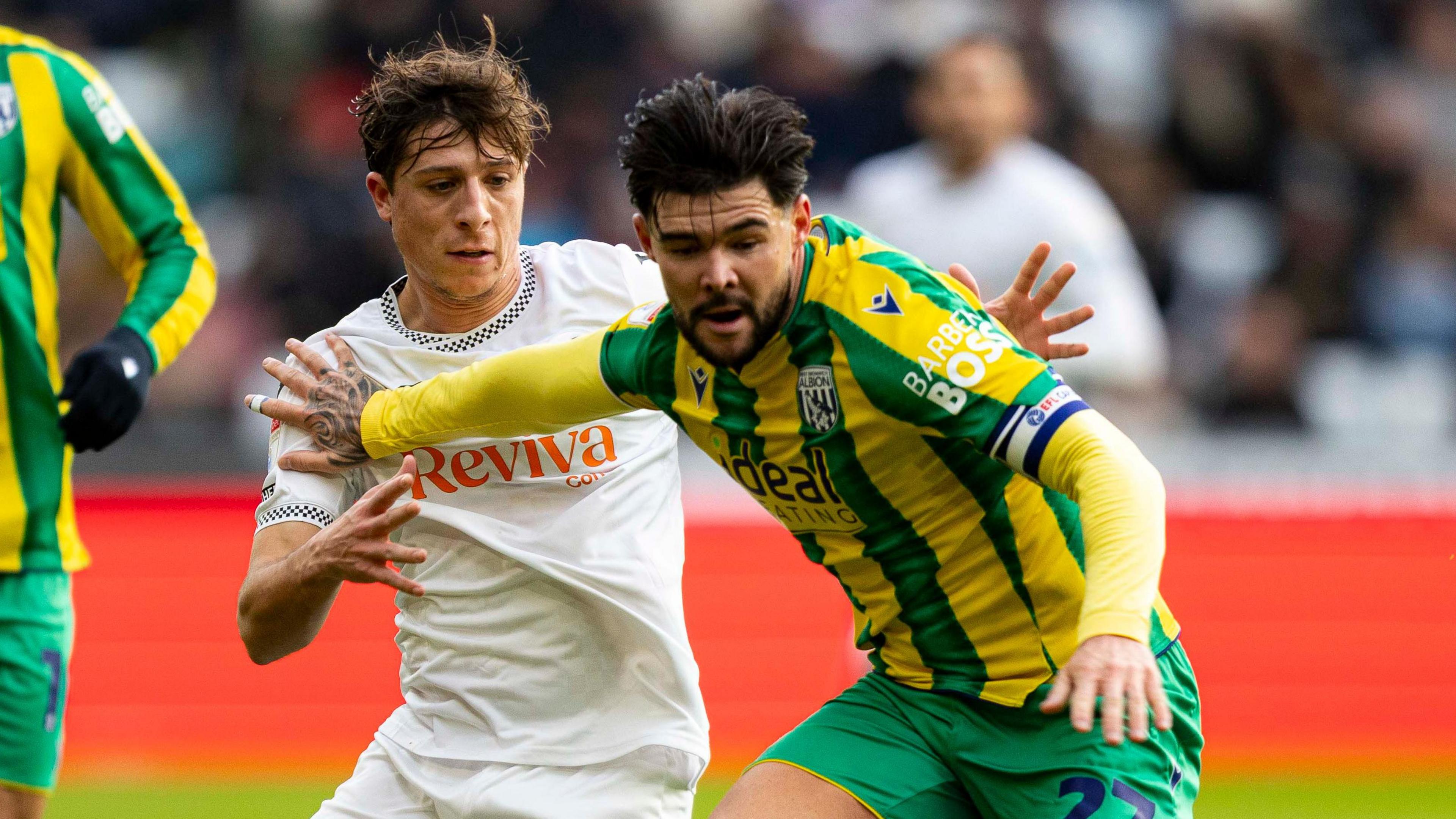 West Brom's Alex Mowatt holds off Swansea's Goncalo Franco