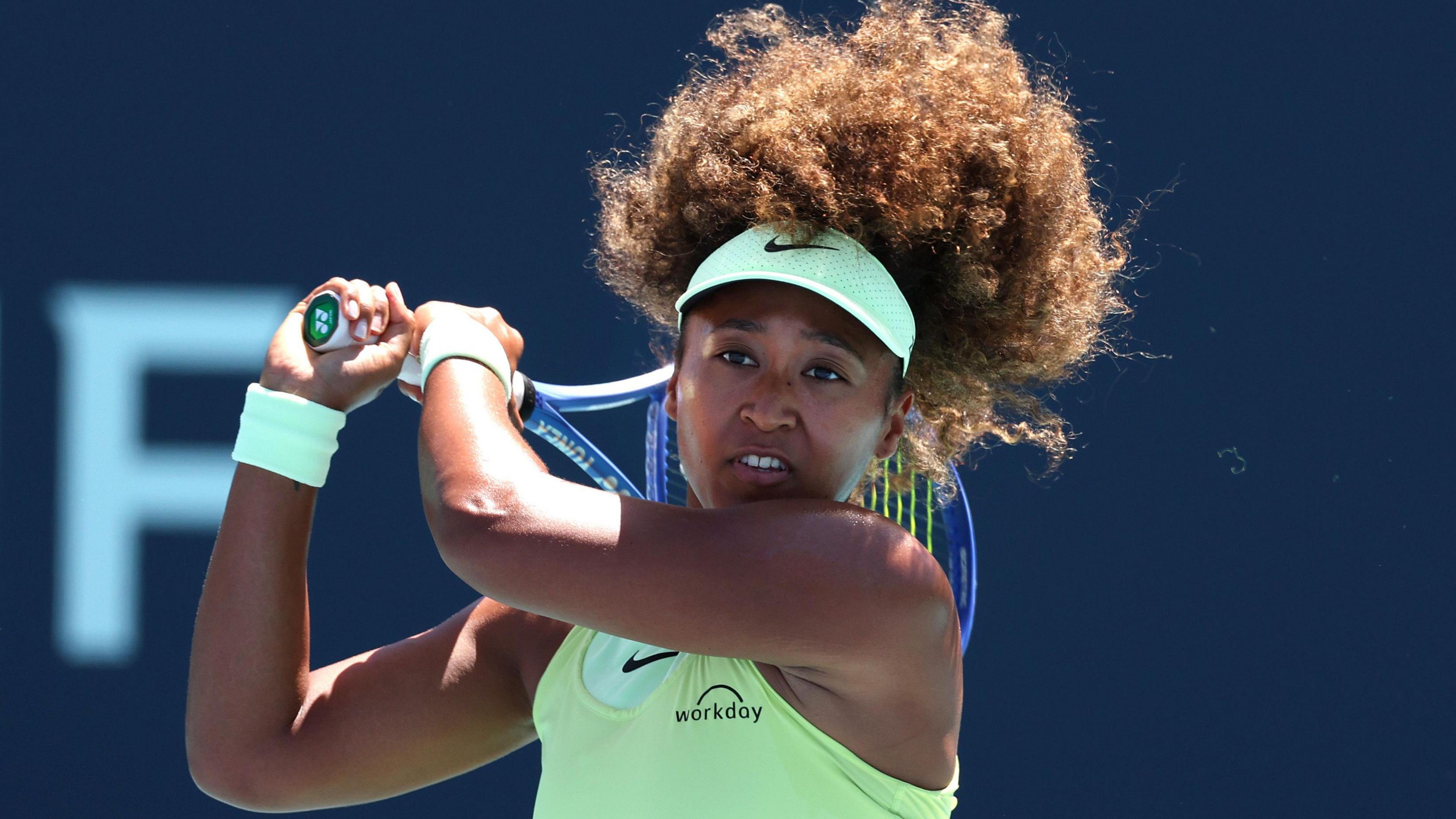 Naomi Osaka plays a backhand at the 2025 Miami Open