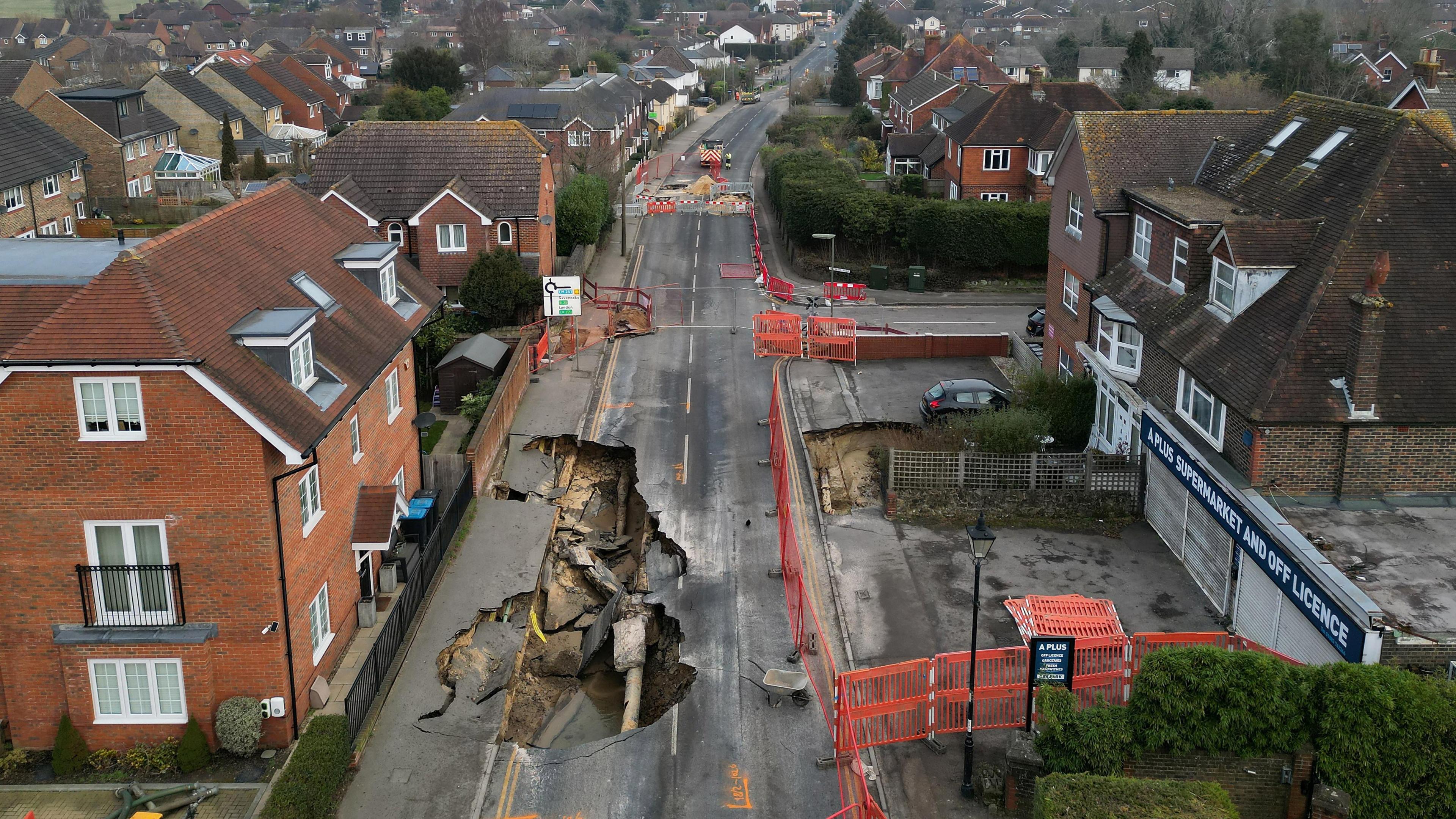  A drone view shows a large sinkhole in Godstone, southern Britain