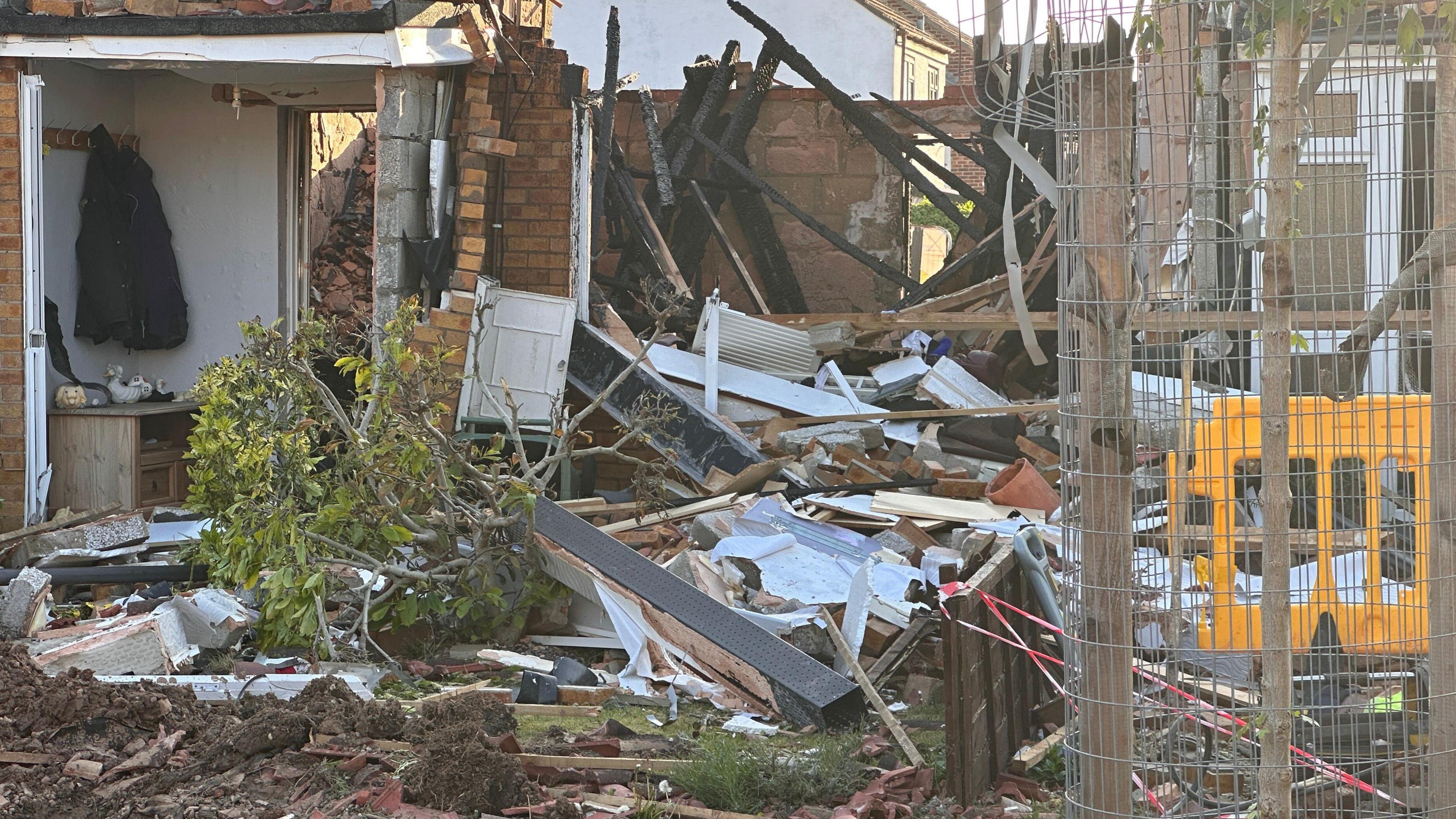 A close up of the debris and wreckage left after a suspected gas explosion in Yate.