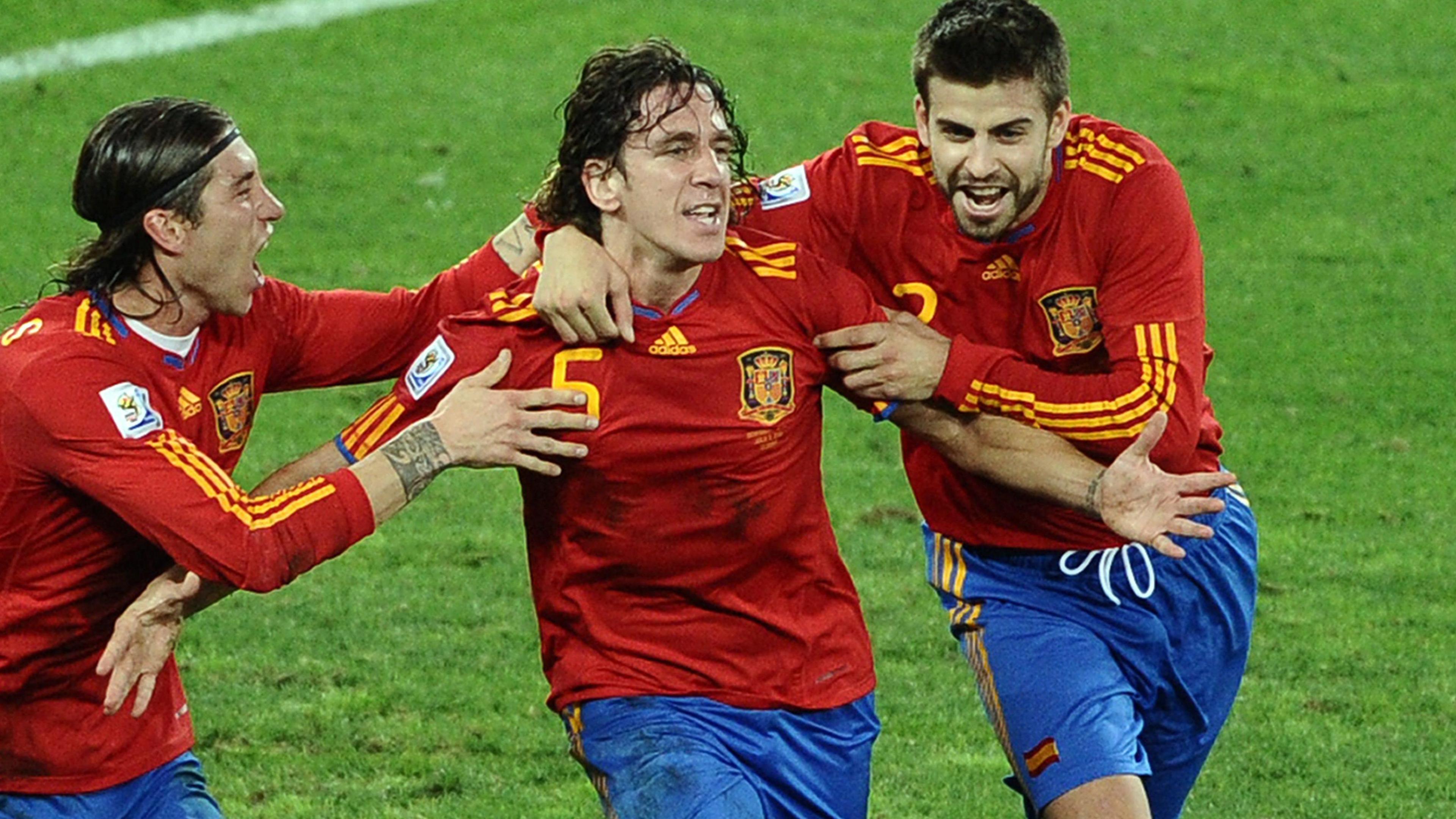 Sergio Ramos, Carles Puyol and Gerard Pique celebrate