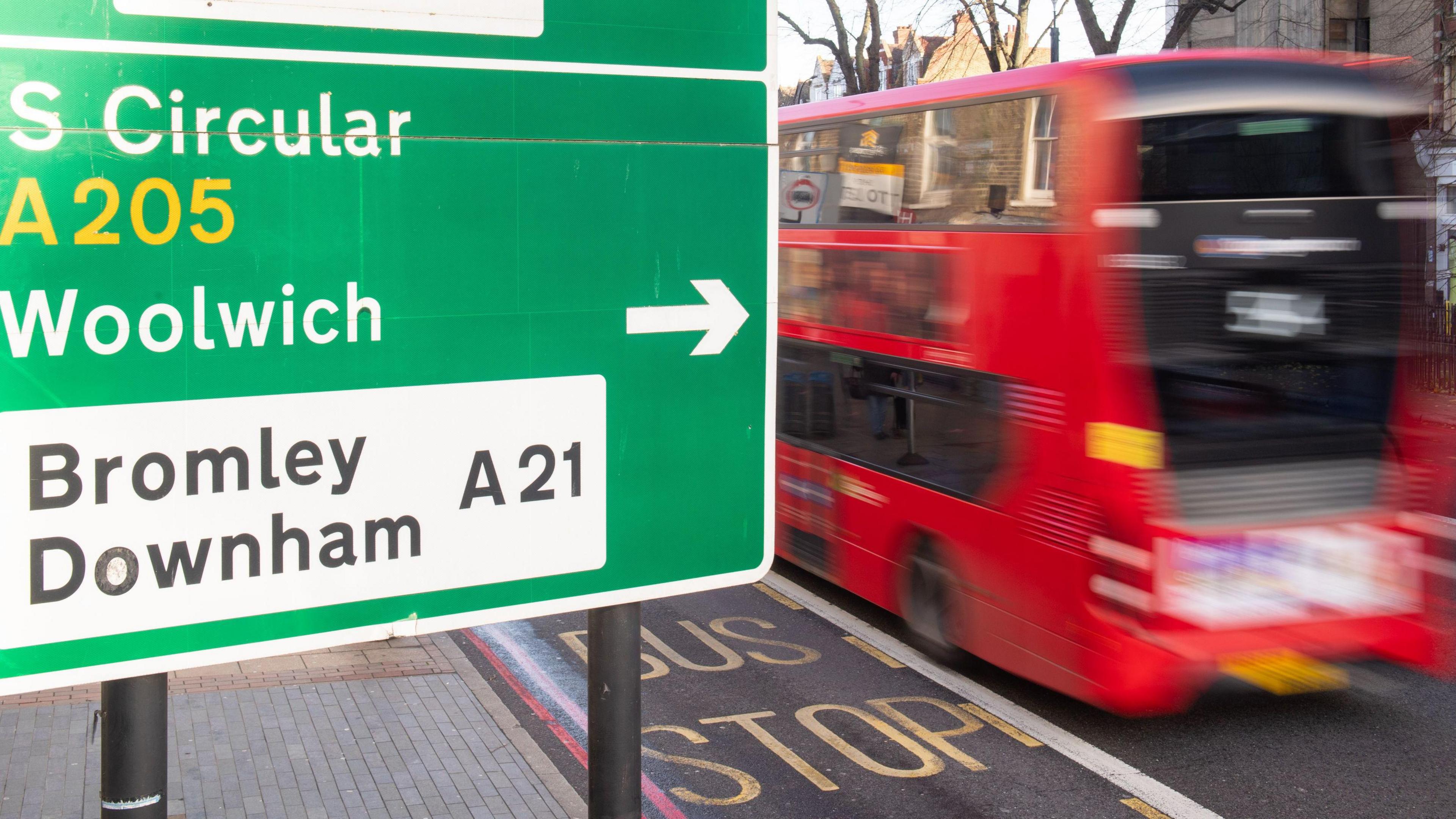 File image of a bus passing by a sign for the South Circular road in London