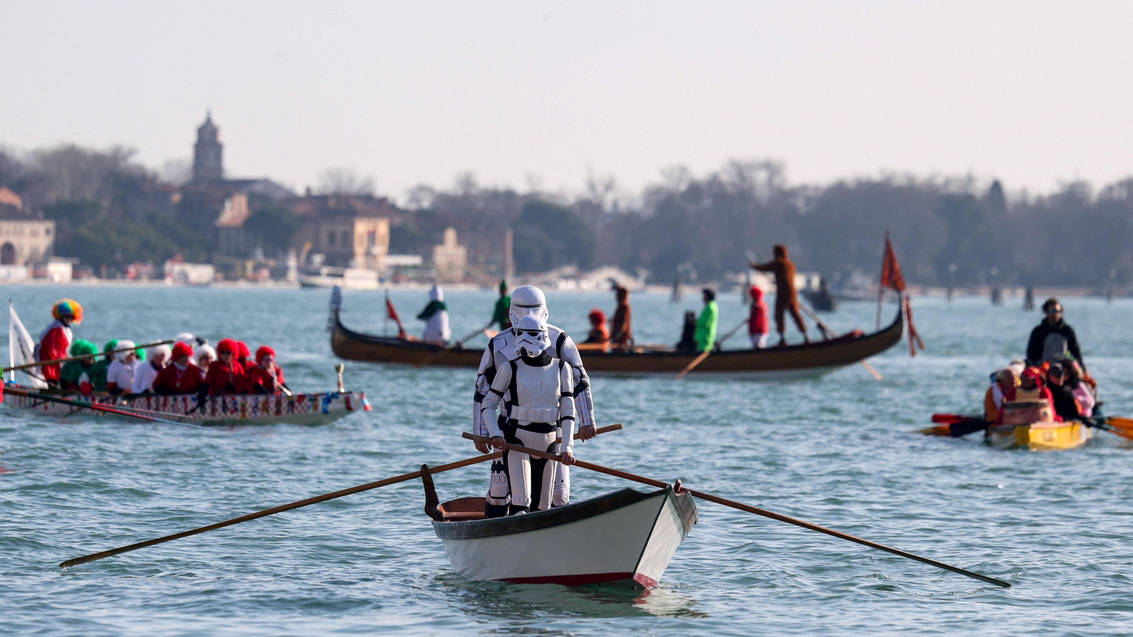 Revellers, dressed as characters from Star Wars franchise, row during the masquerade parade on the Grand Canal during the Venice Carnival,