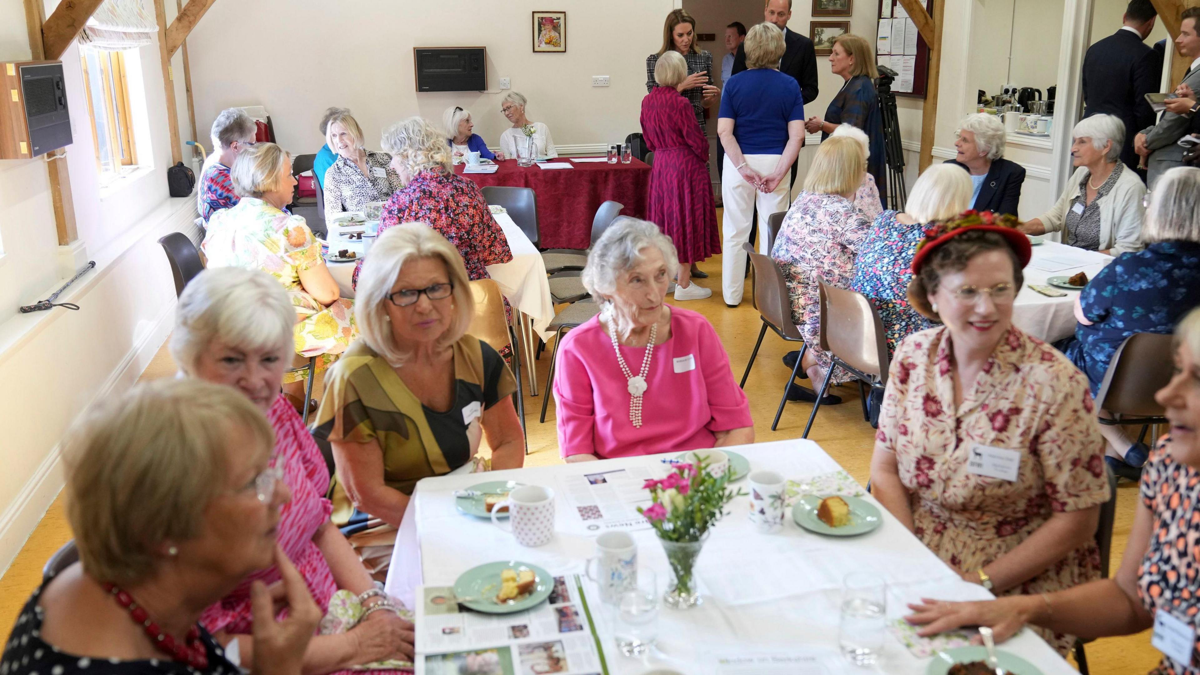 The Prince and Princess of Wales (back right) during a visit to the National Federation of Women's Institute (WI) in Sunningdale, Berkshire, to mark the third anniversary Queen Elizabeth II's death.