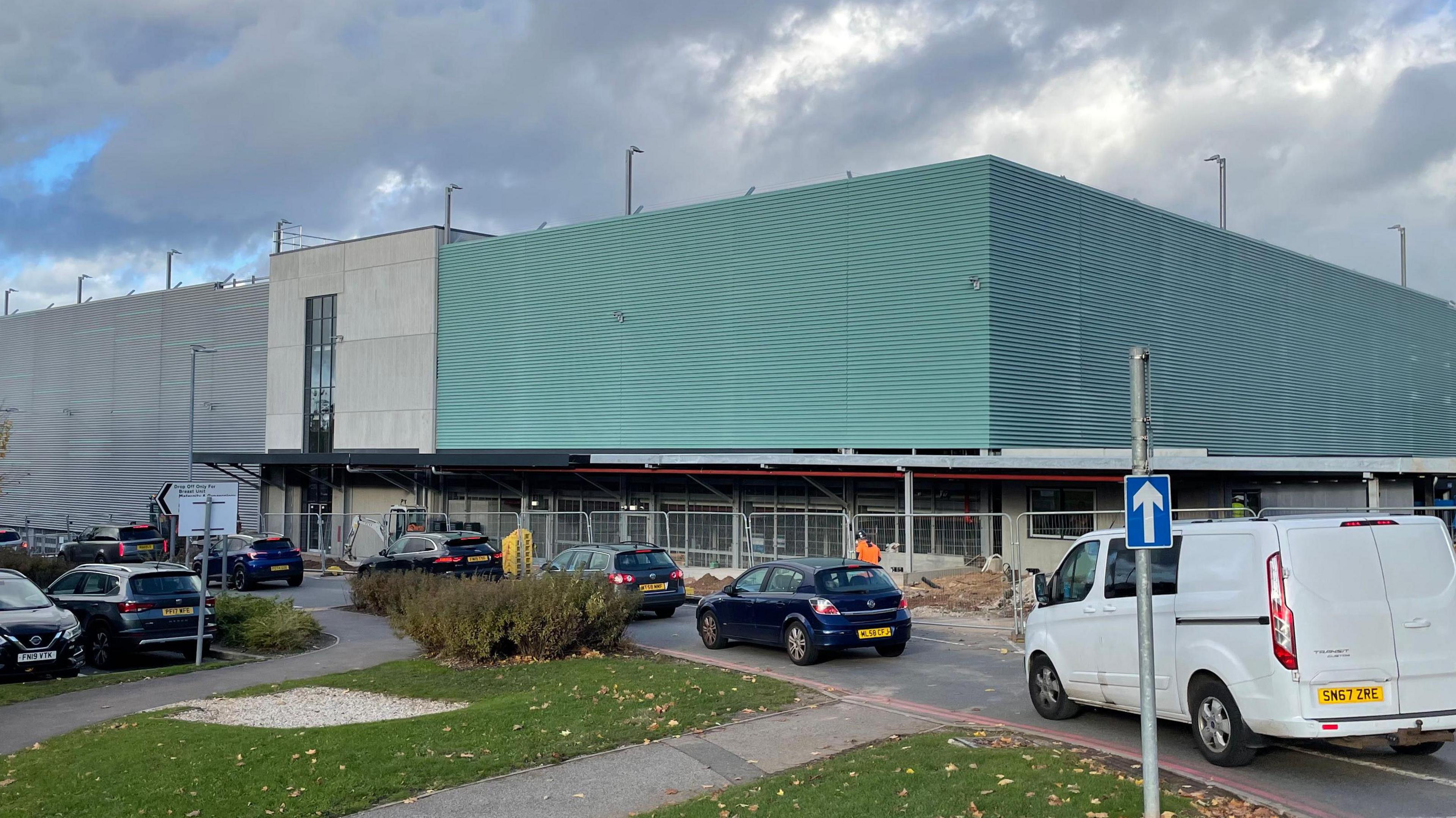 Multi-storey car park with green cladding