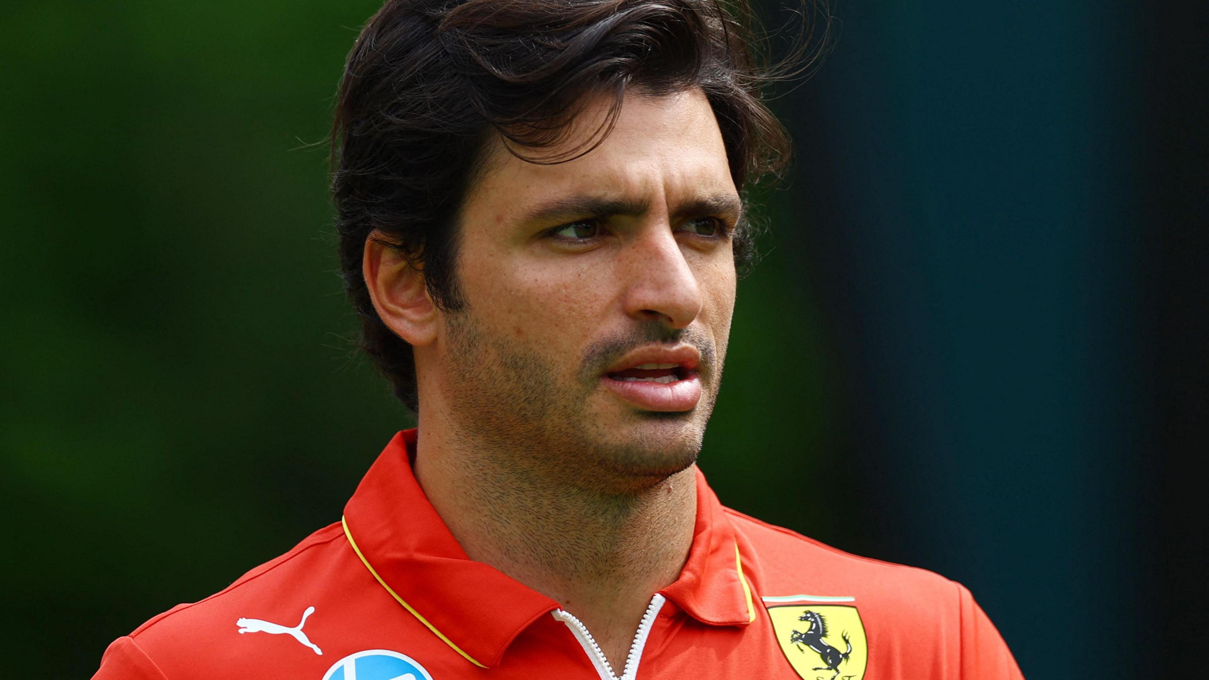 Carlos Sainz pictured in a Ferrari uniform