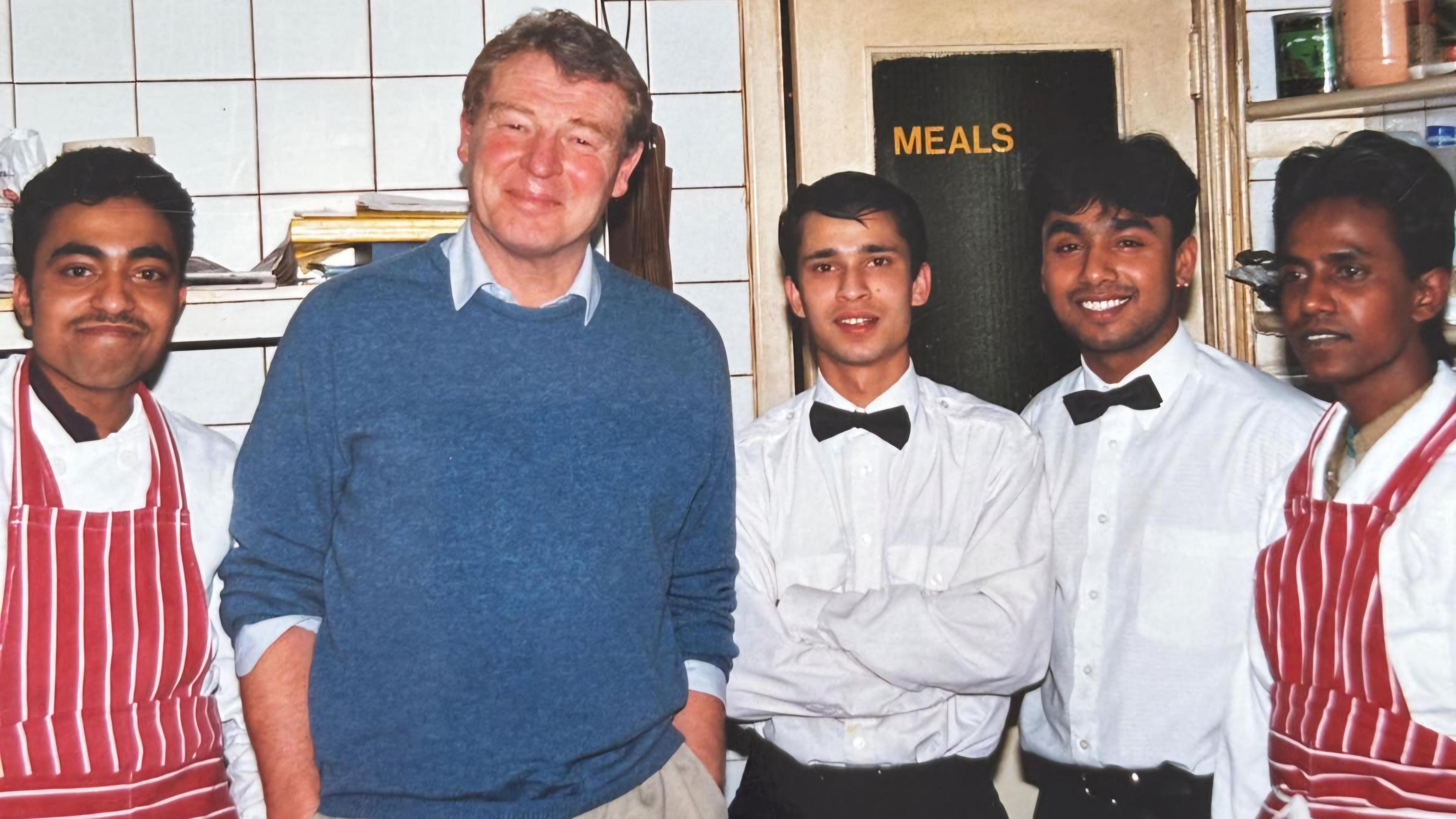 Luthfur Rahman with Lord Ashdown and colleagues in his restaurant kitchen