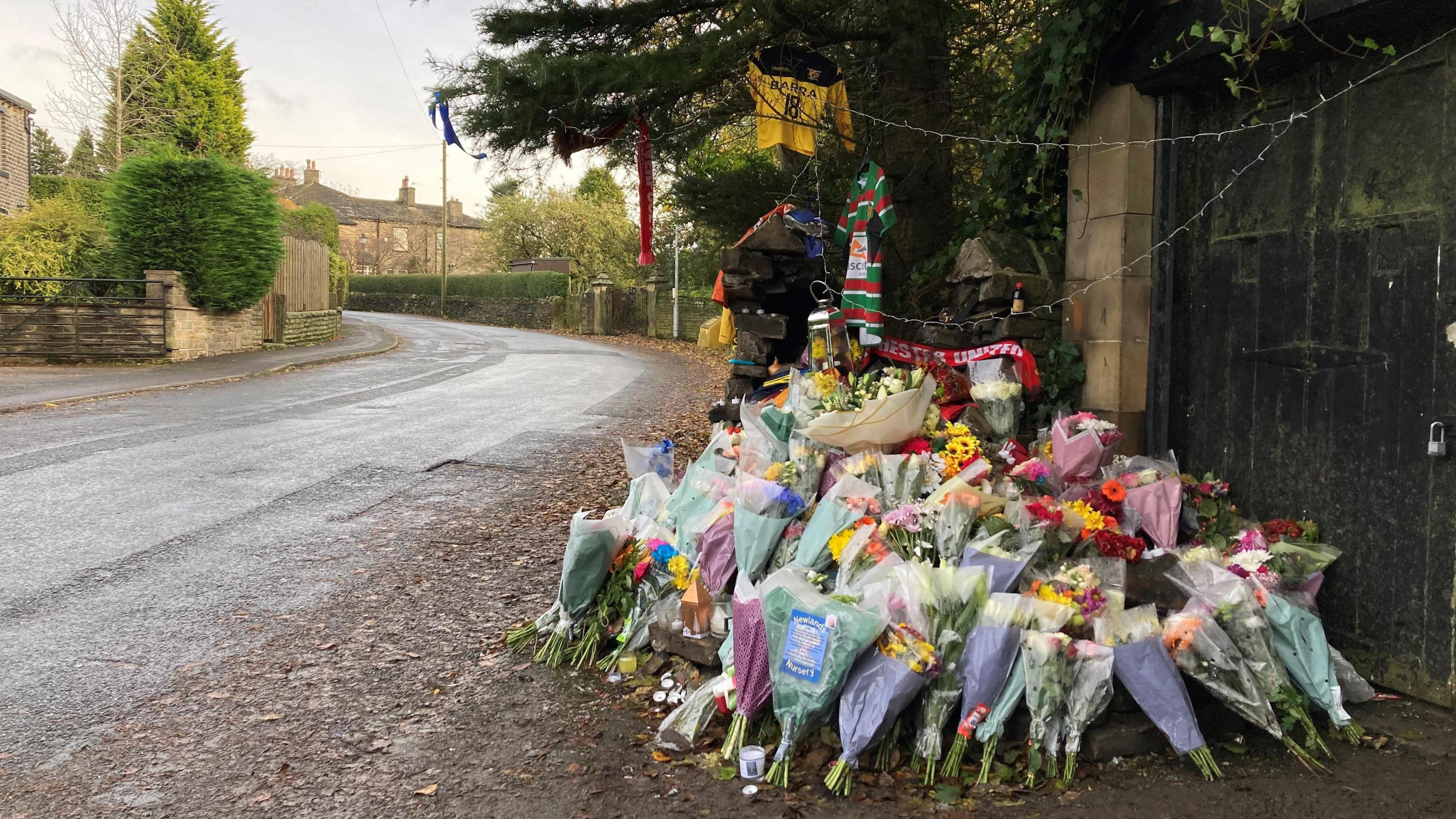 Flowers left on side of road as a tribute 