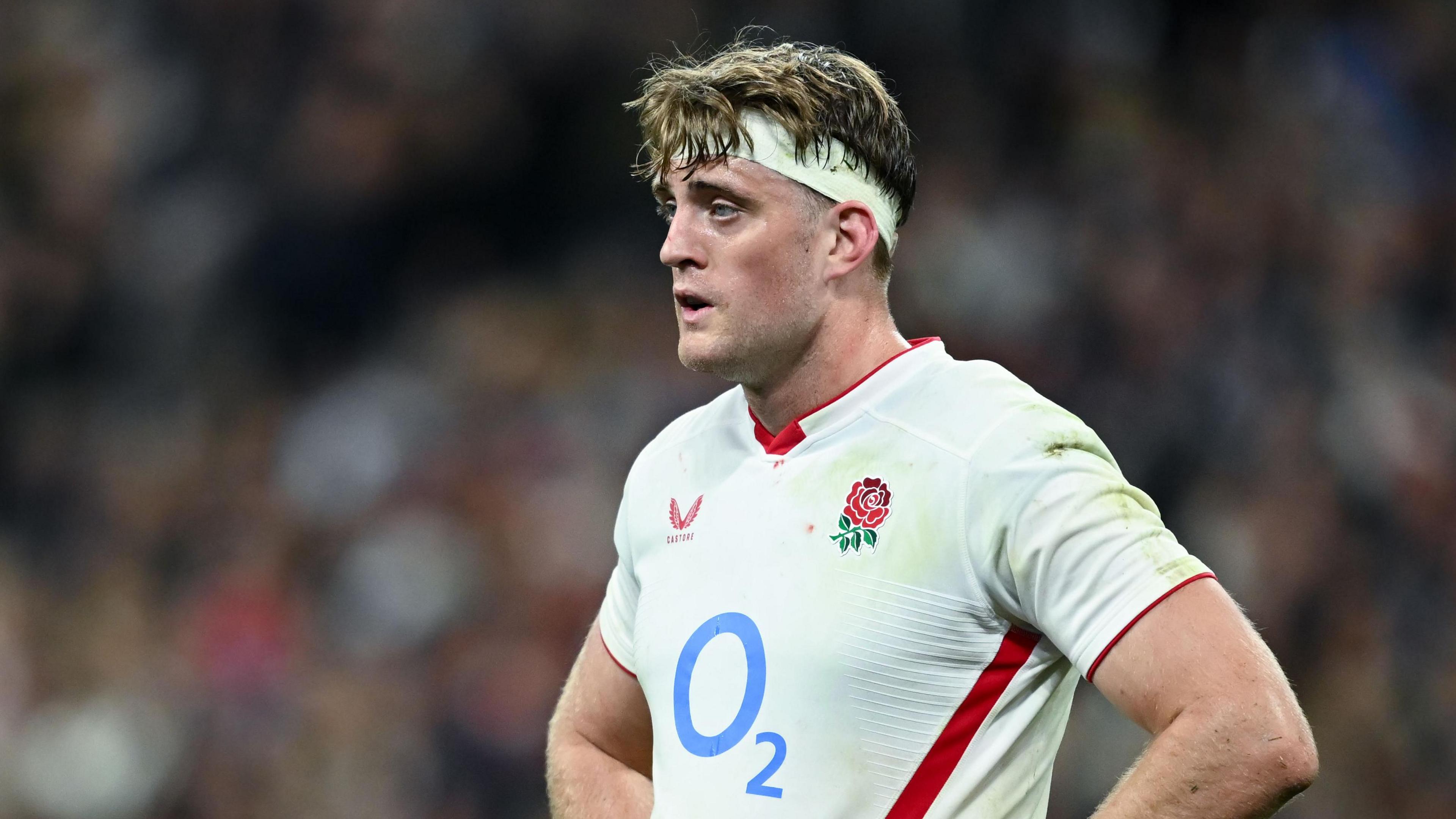 Alex Coles standing with his hands on his hips during England's match against France in the Six Nations