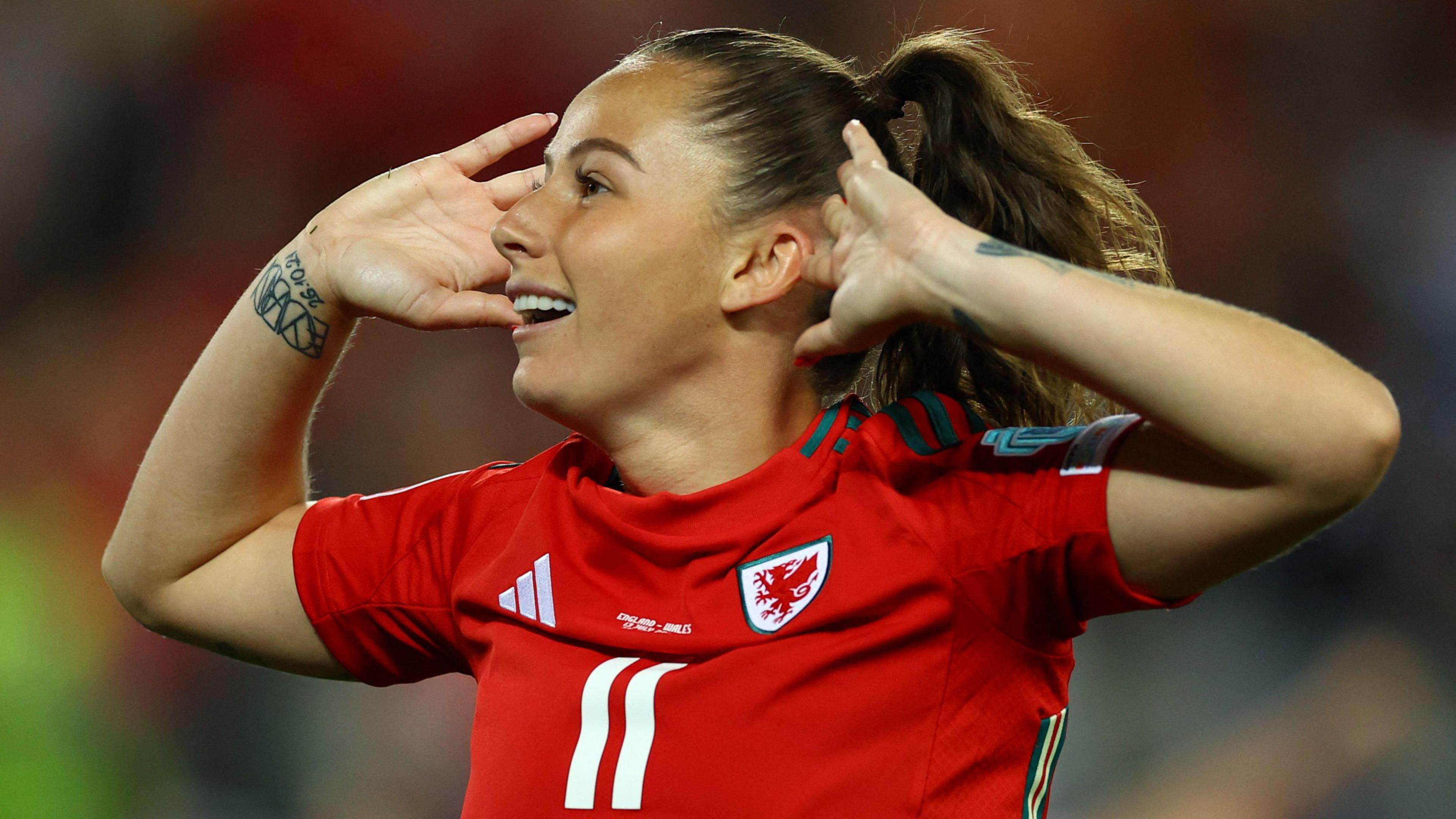 Wales' Hannah Cain celebrates scoring their first goal