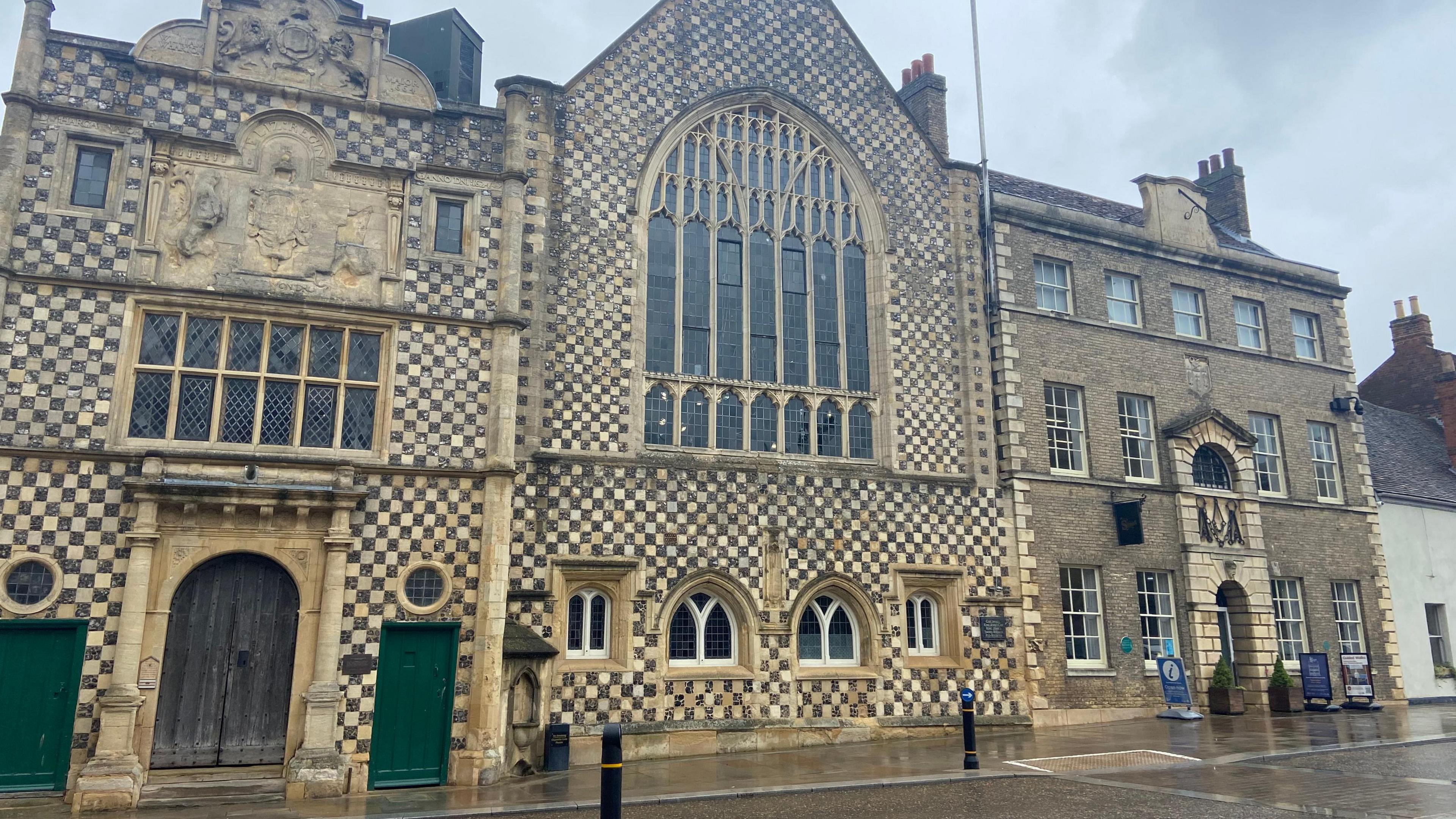 Yellow and brown checked frontage of town hall