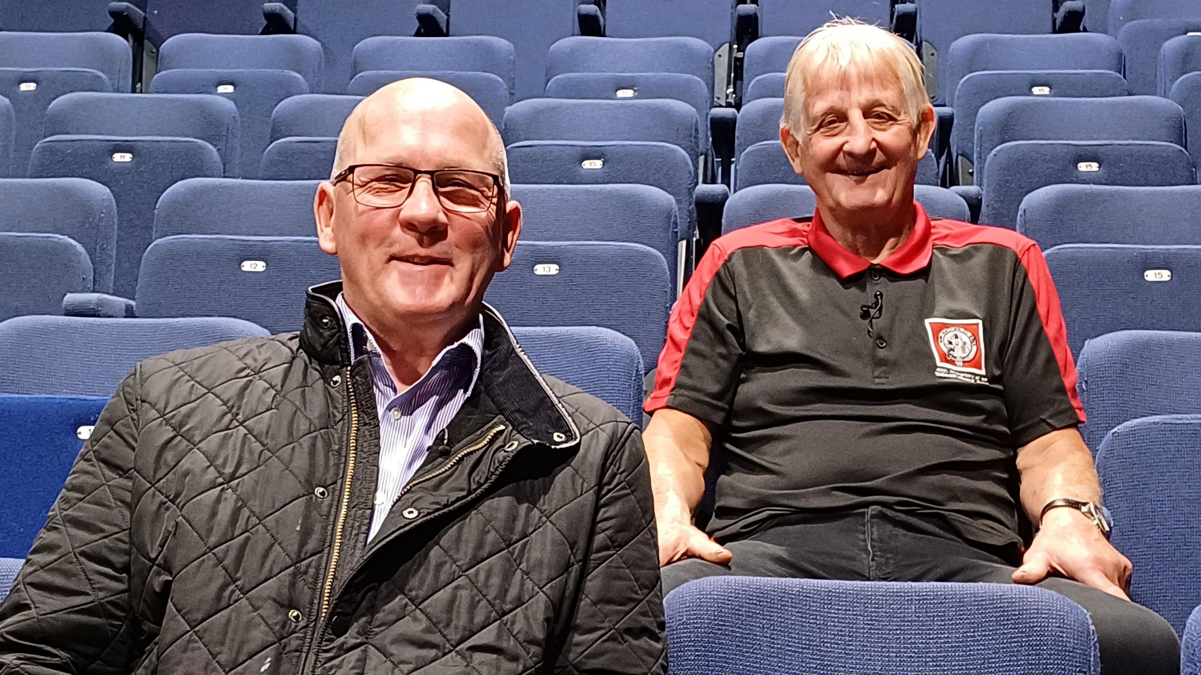 Former miners Wayne Thomas, who is now South Wales Secretary of the NUM, and Ron Stoate who is chair of trustees for the Cefn Fforest Miners' Institute, in the auditorium of the Blackwood Miners Institute 